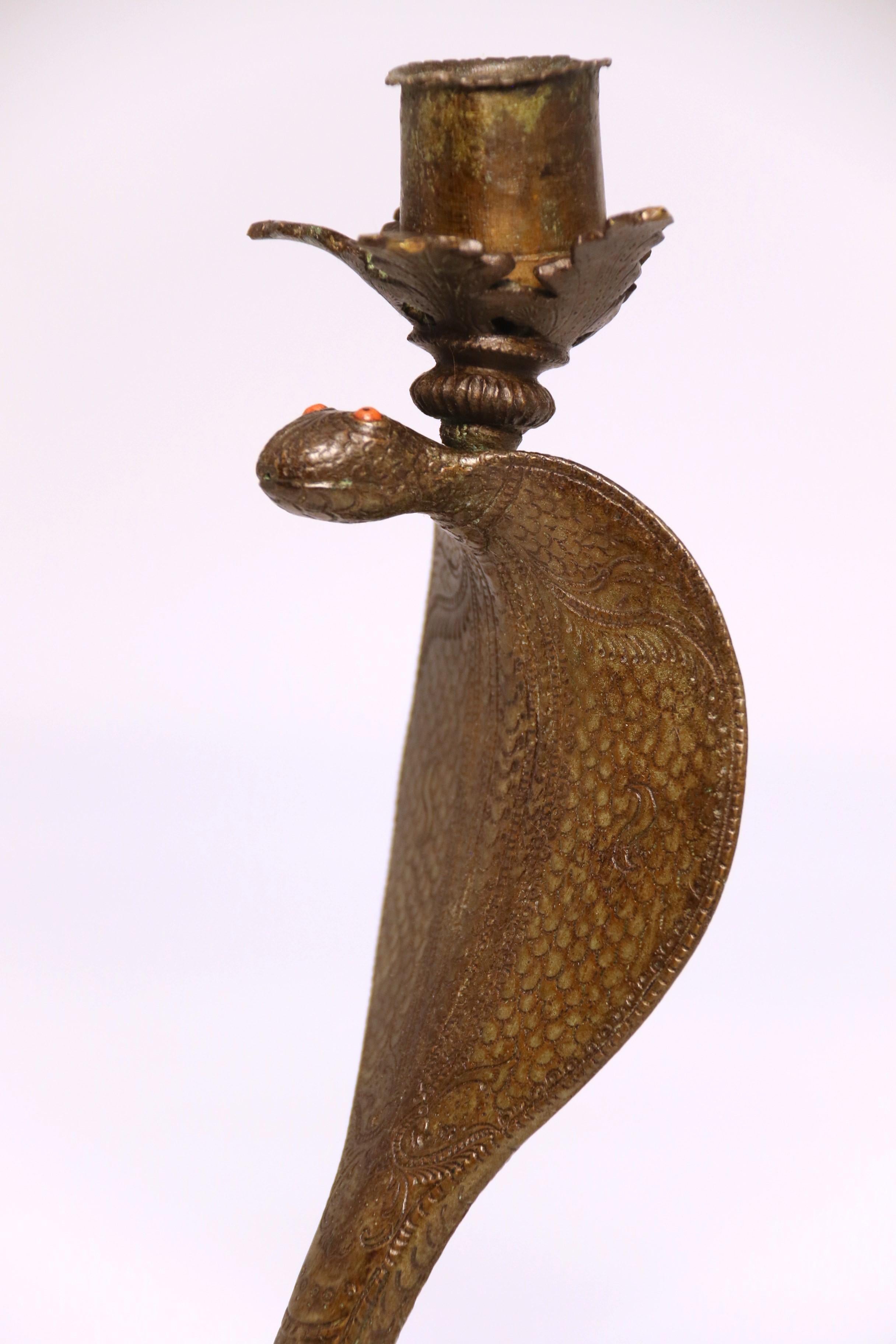 A pair of Raj period Indian bronze candlesticks in the form of striking cobras 10