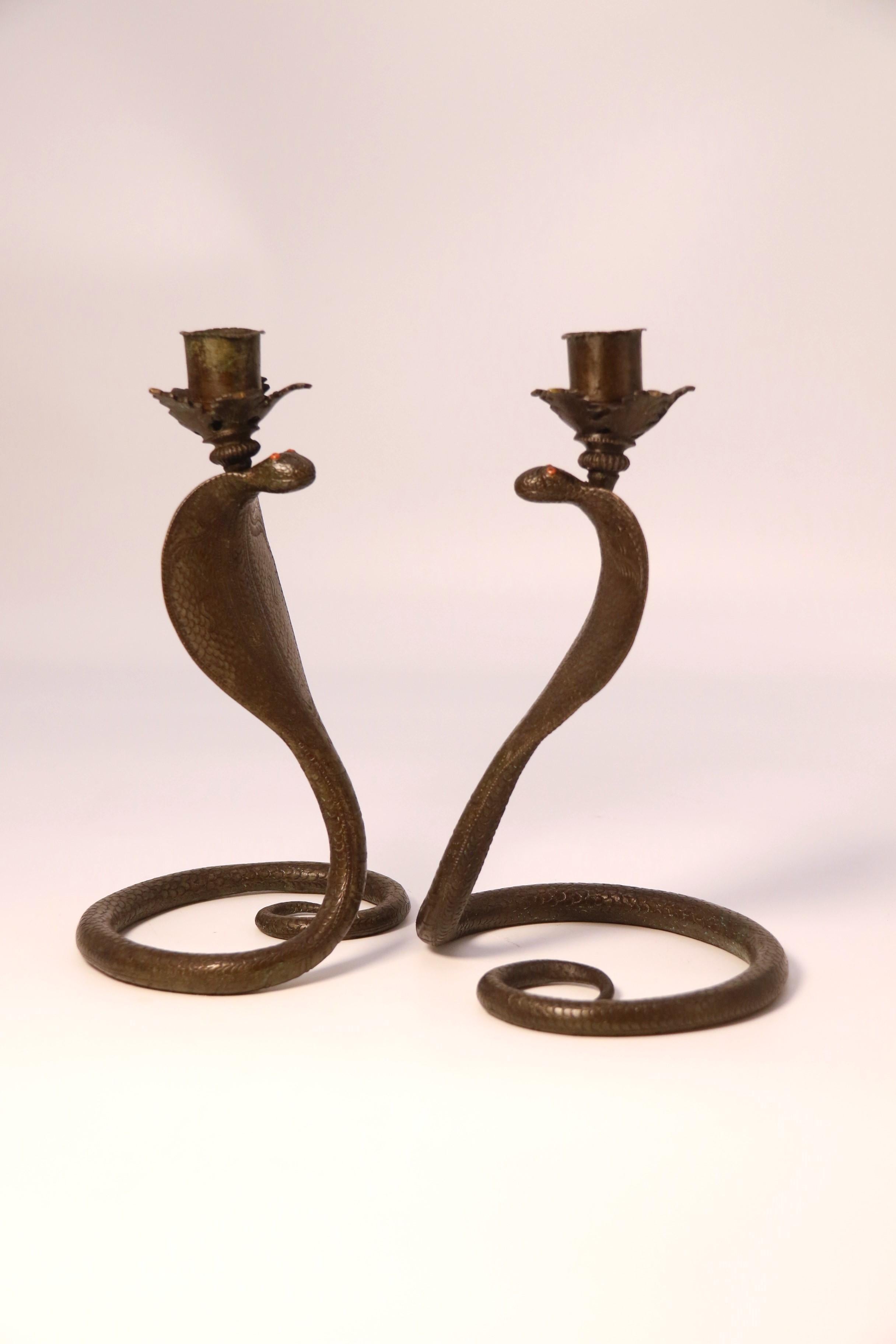 19th Century A pair of Raj period Indian bronze candlesticks in the form of striking cobras