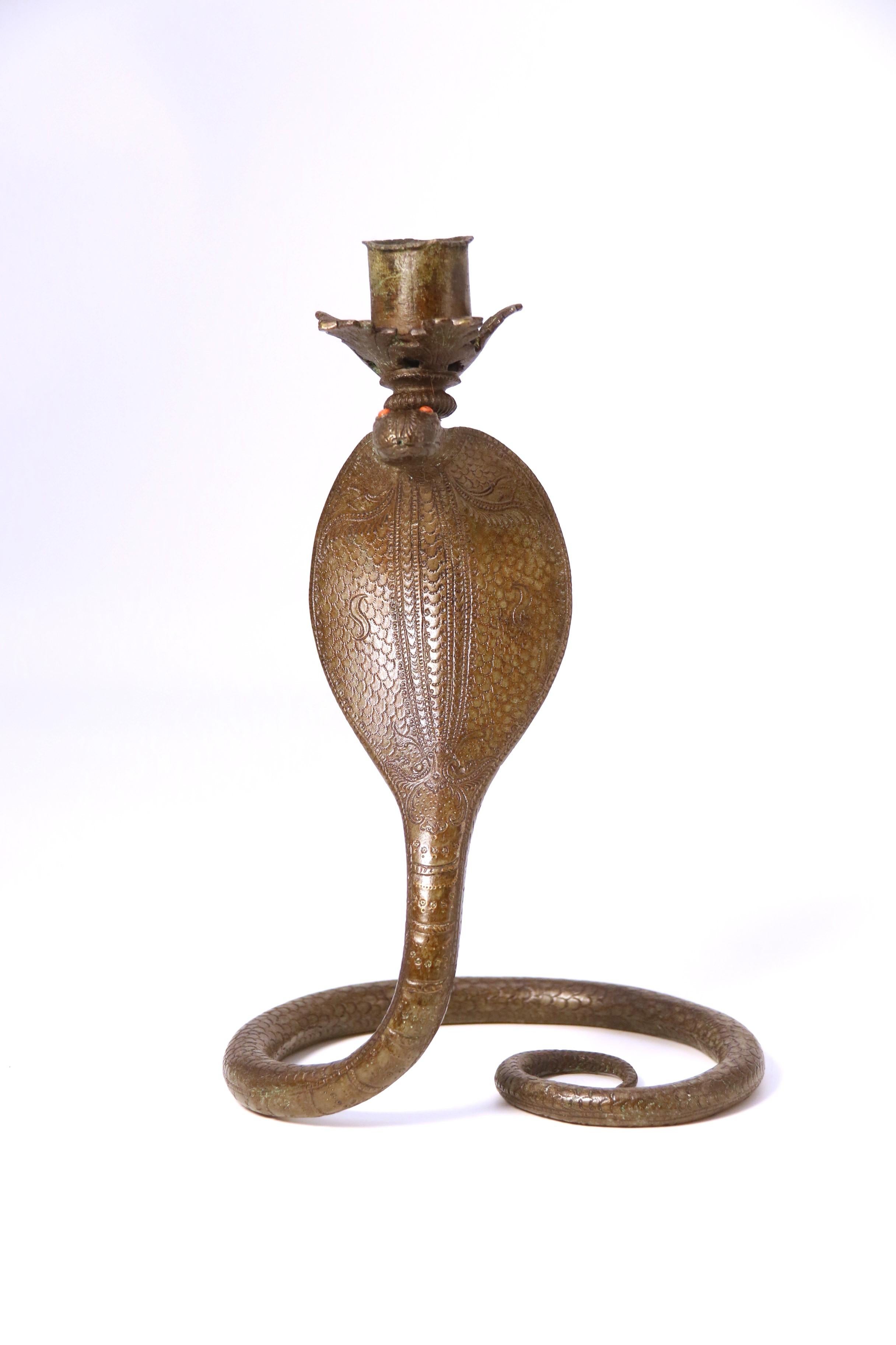 Bronze A pair of Raj period Indian bronze candlesticks in the form of striking cobras