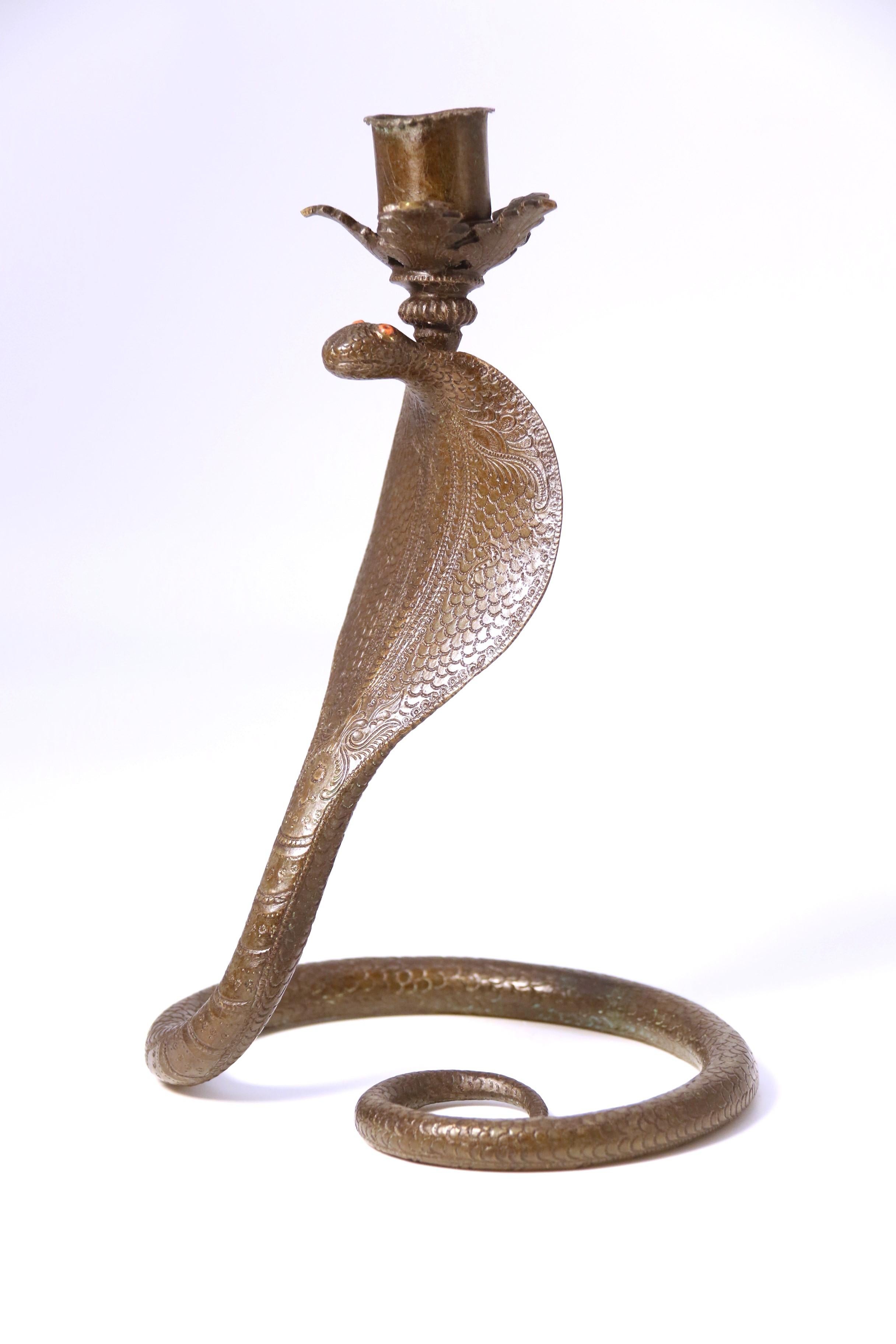 A pair of Raj period Indian bronze candlesticks in the form of striking cobras 1
