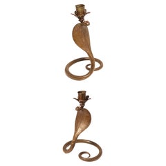 A pair of Raj period Indian bronze candlesticks in the form of striking cobras