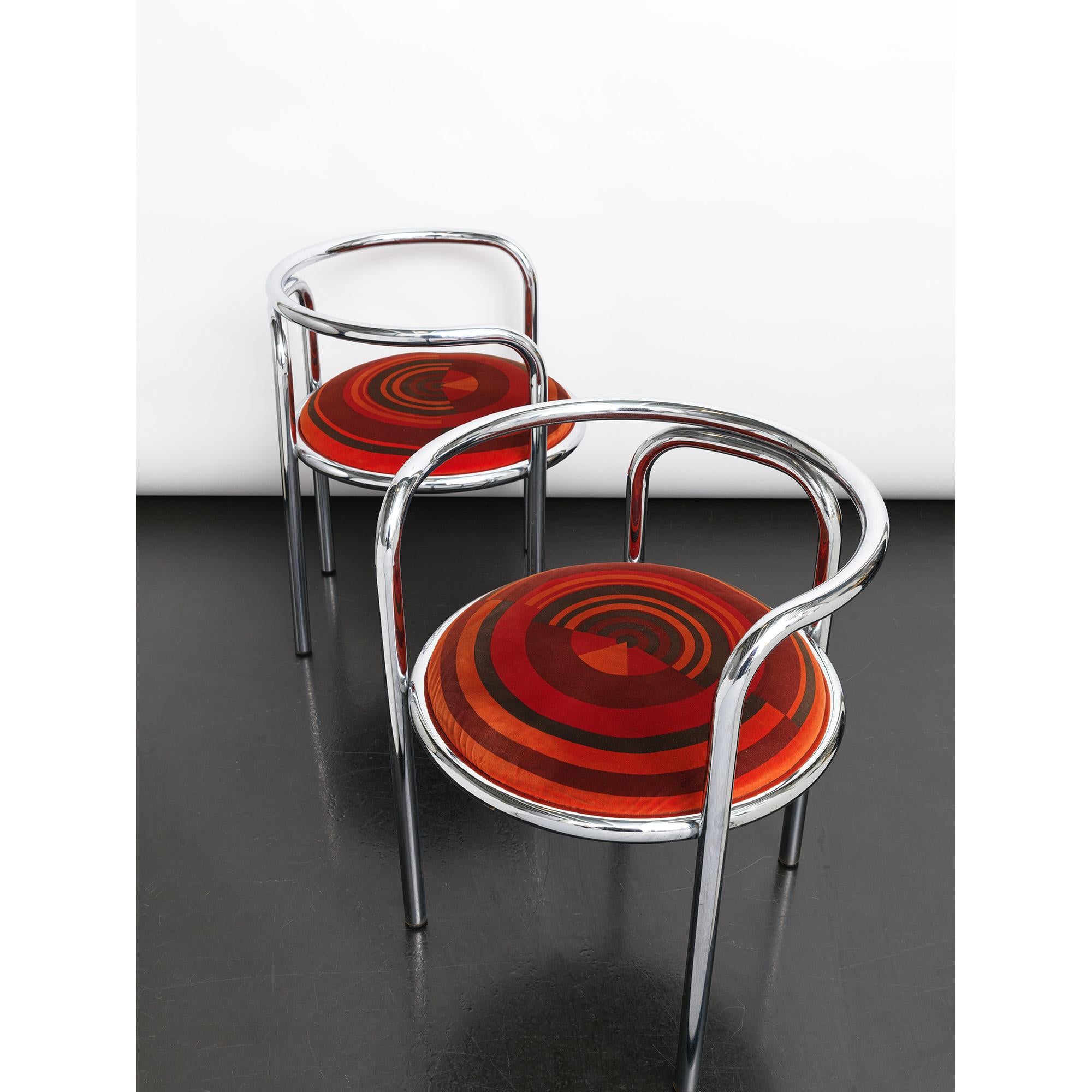 A pair of rare, early edition ‘Locus Solus’ velvet chairs.
‘Locus Solus’ chair was born in 1964 from the genius of the architect Gae Aulenti and was produced by Poltronova.
The geometry of the tubular steel structure recalls the Classic shapes of