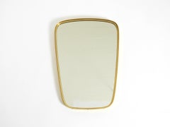 A pair of rare original Mid Century Modern "Münchener Zierspiegel" wall mirrors