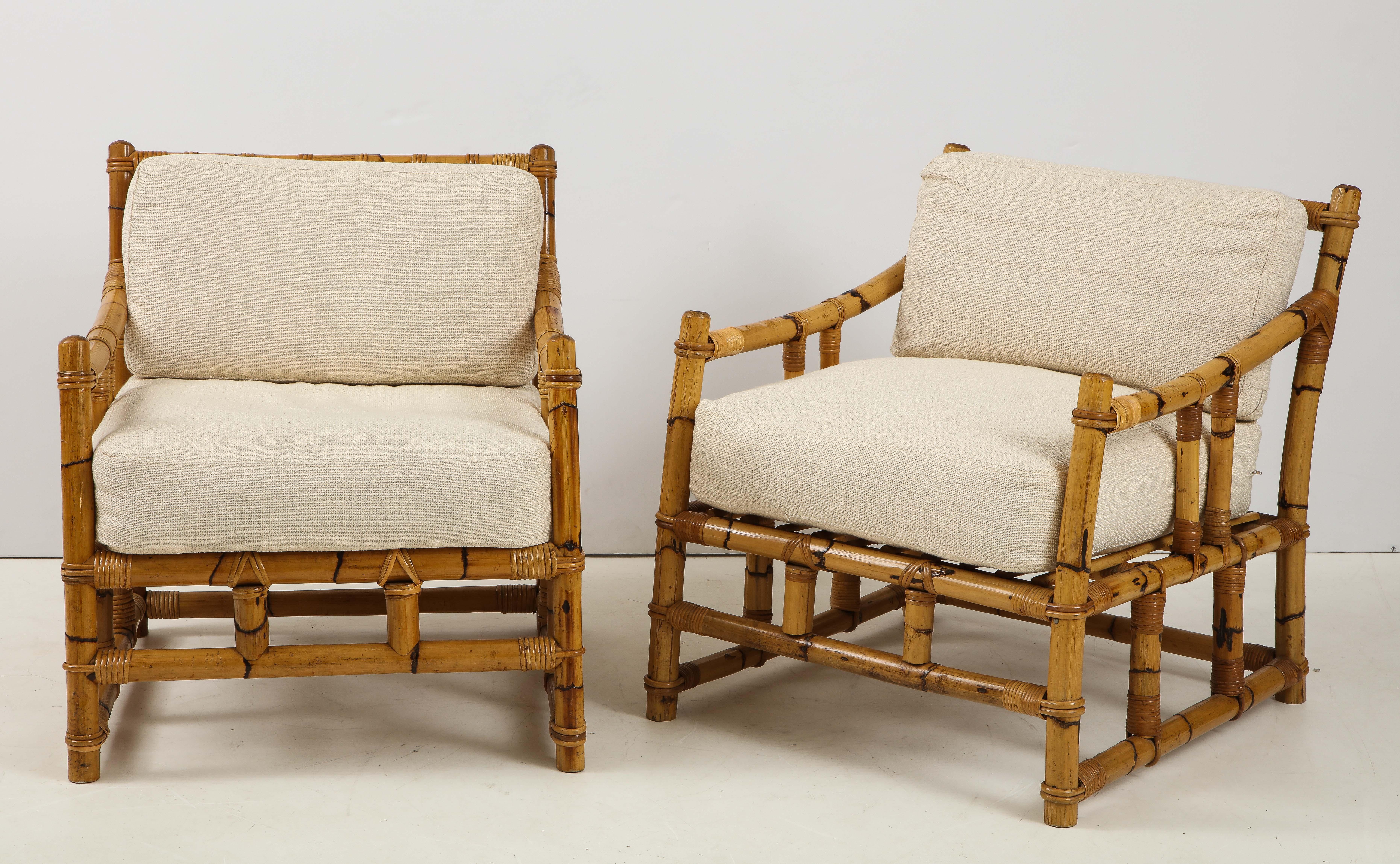 Enjoy summer all year round with this fabulous pair of vintage rattan chairs from France! Very well constructed and sturdy, the chairs have a wonderful warm color and feature neutral toned seat cushions.