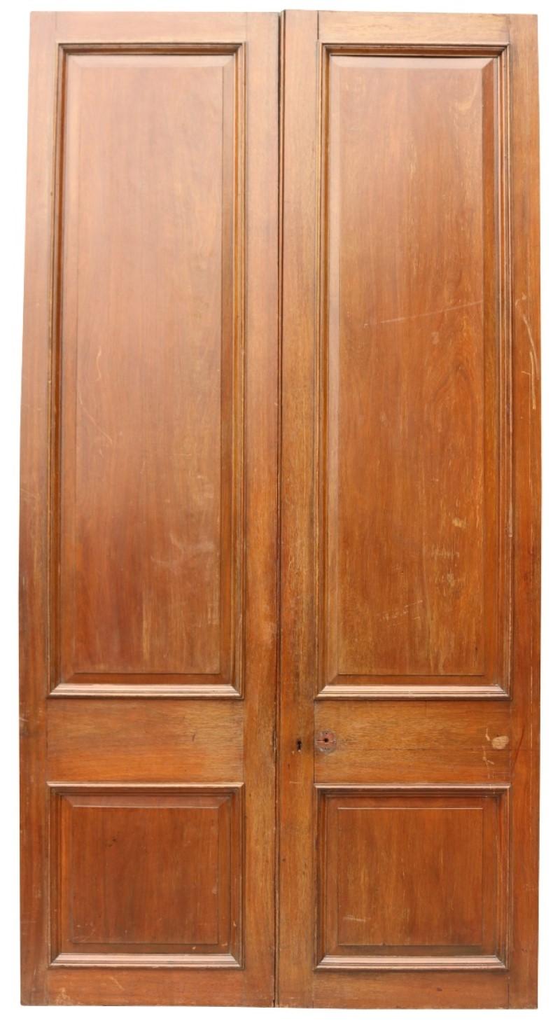 Removed from a room of the RAC Clubhouse in Pall Mall, London. We have a second pair and a run of Teak panelling also available.

Very good quality timber doors with raised and fielded panels.