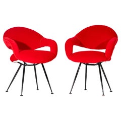 A Pair of Red Armchairs designed by Tito Agnoli
