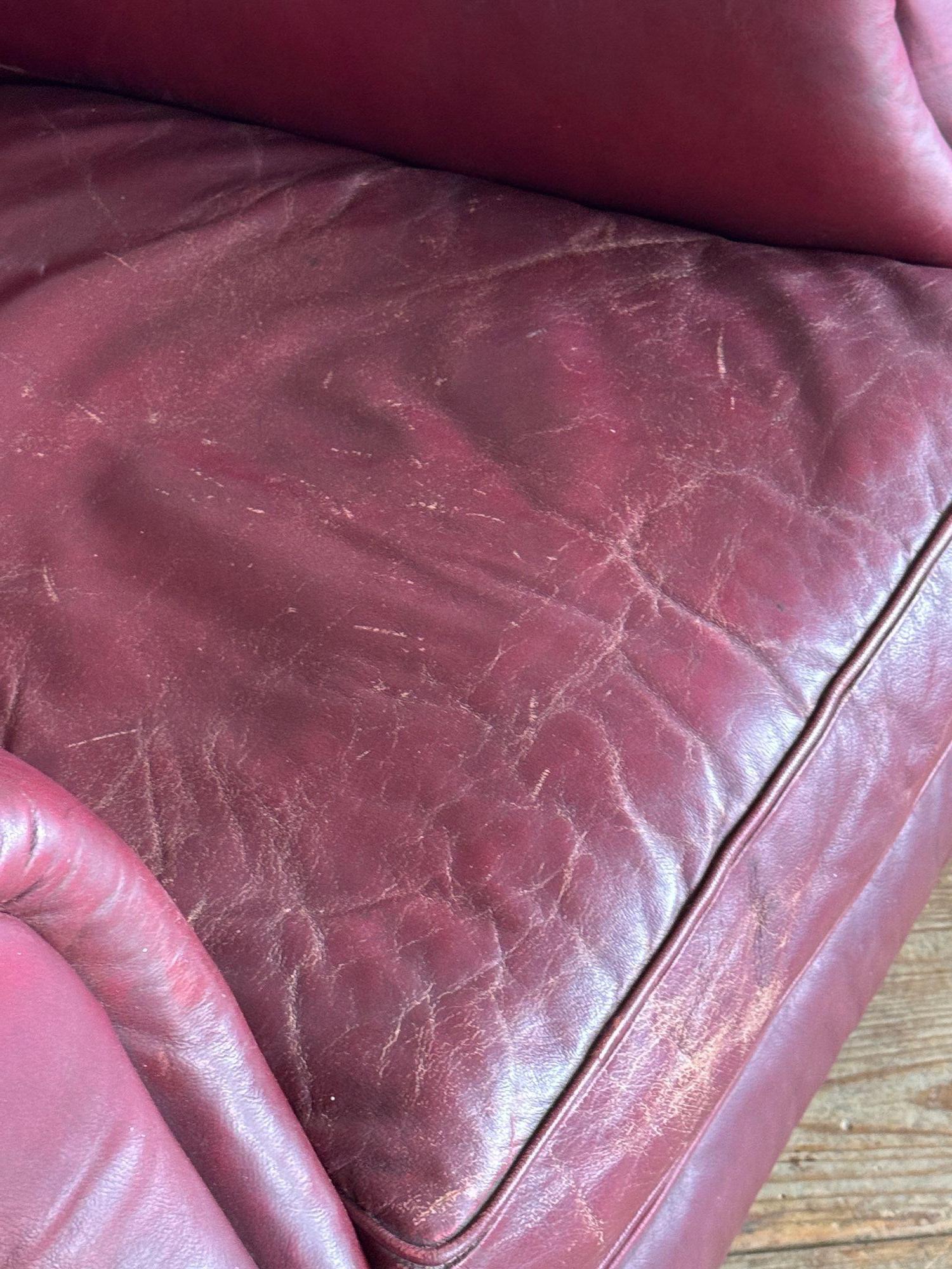 A pair of red leather club chairs For Sale 4