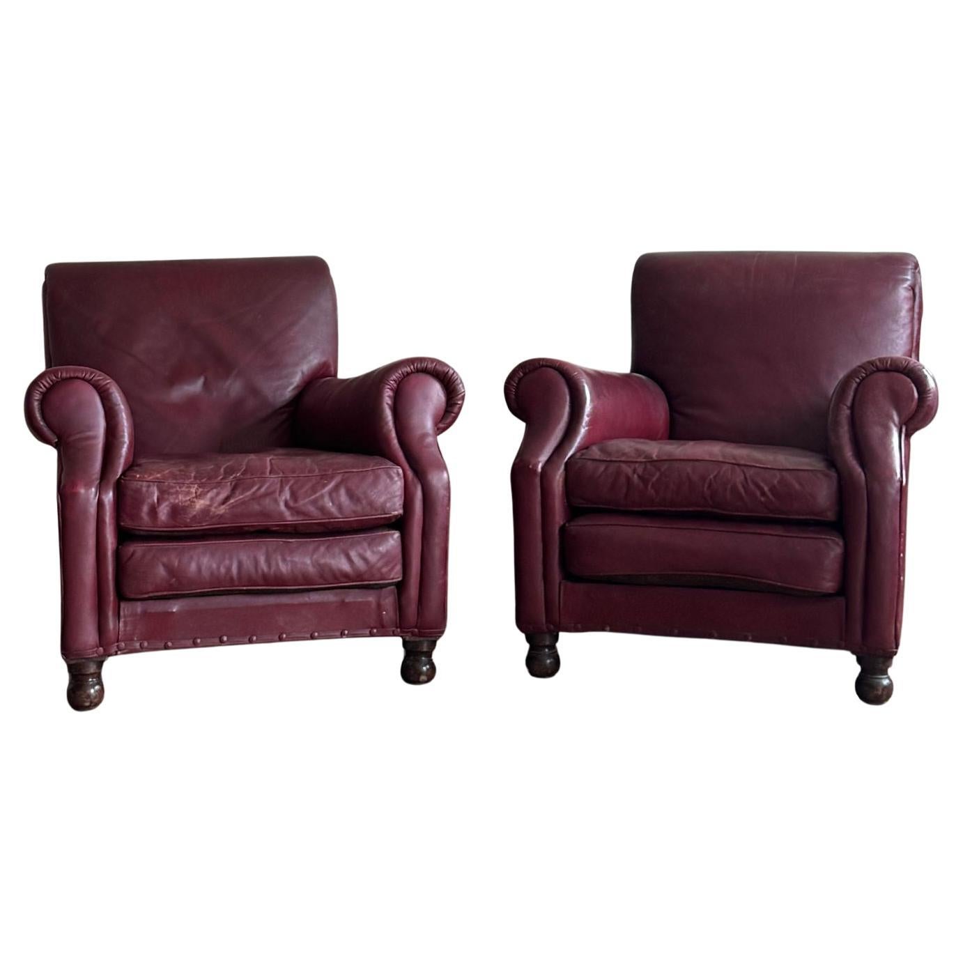 A pair of red leather club chairs For Sale