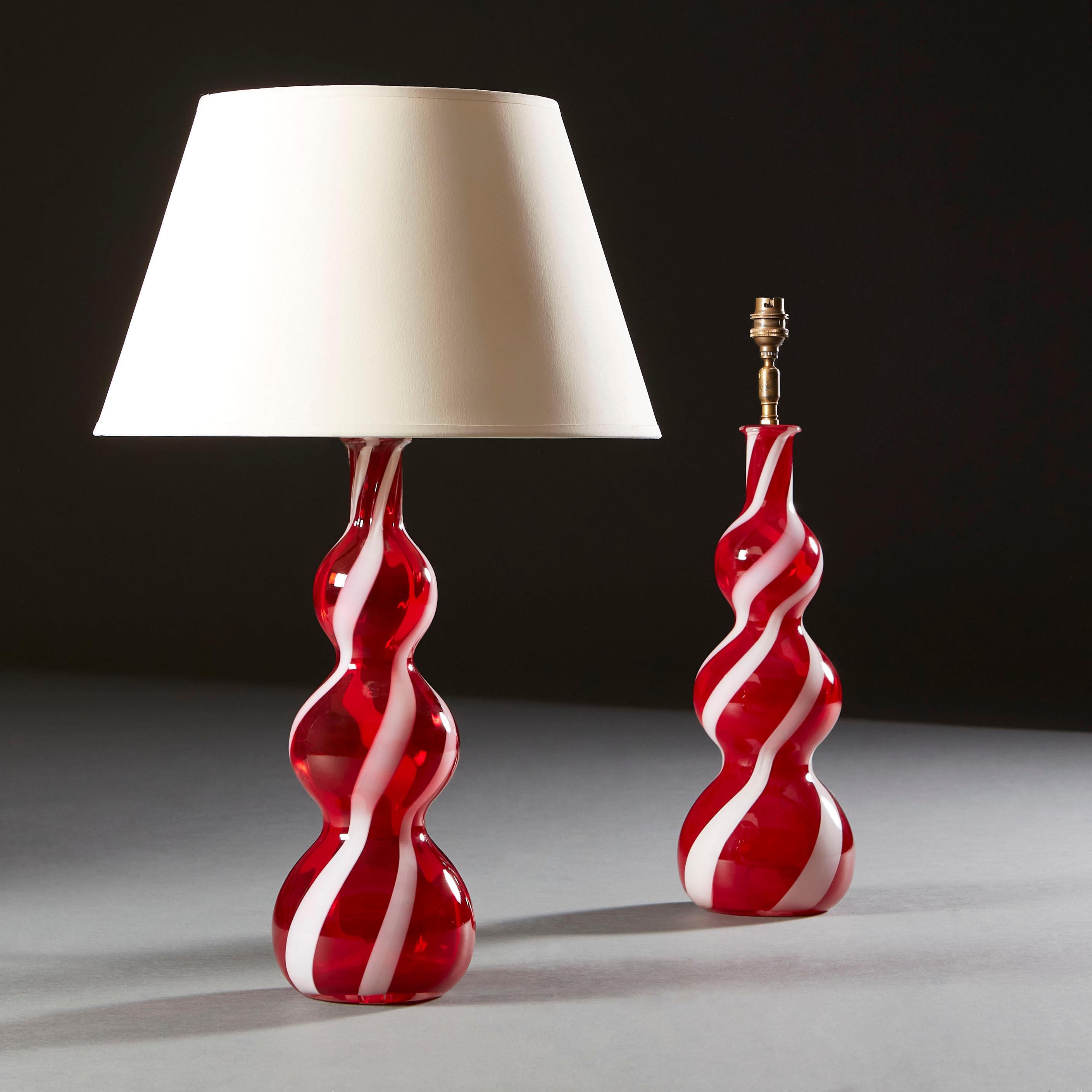 A pair of twentieth century red triple gourd Murano vases, now as lamps.

Currently wired for the UK.

Please note: Lampshades not included.