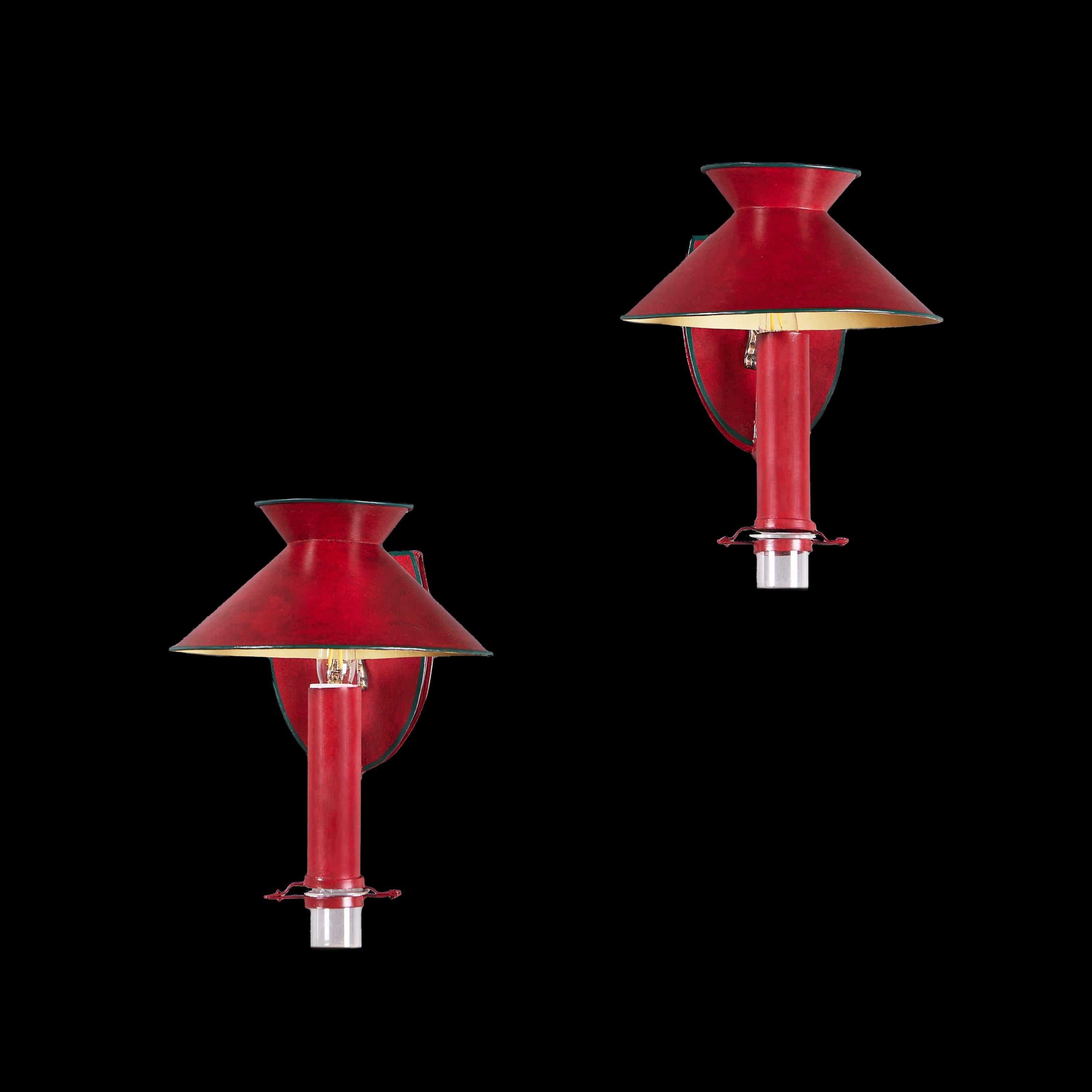 France, circa 1920

A pair of early twentieth century red tole wall lights of shield back design with brass anthemions, conical shaped shades and glass drip trays.

Height 26.00cm
Width 20.00cm
Depth 26.00cm

Please note: This is currently wired for