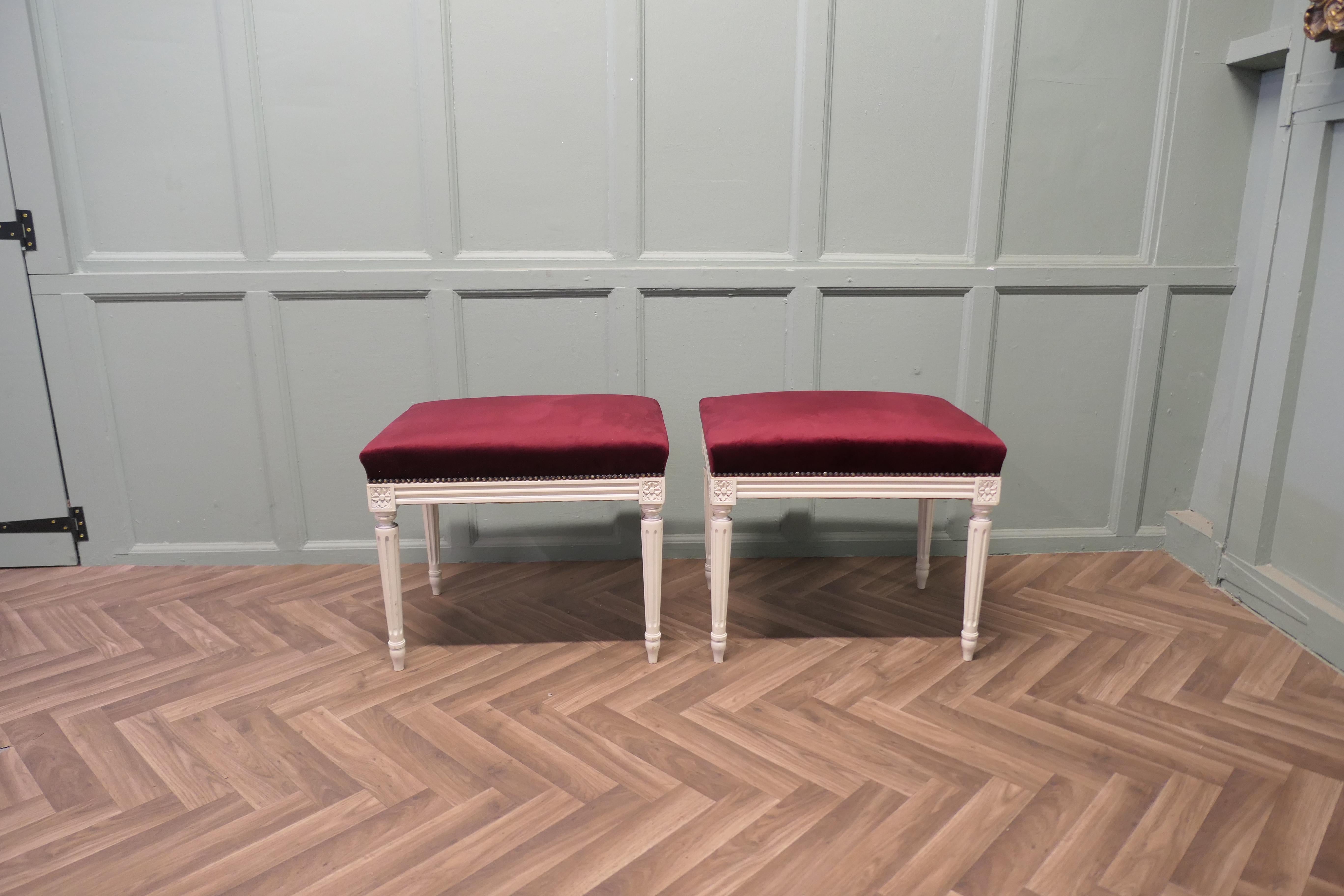 A Pair of Red Velvet Library or Window Stools

A Lovely pair, these very attractive Victorian stools stand on elegant fluted white legs with matching carving to the apron The stools have been upholstered in rich deep red velvet
The stools are in