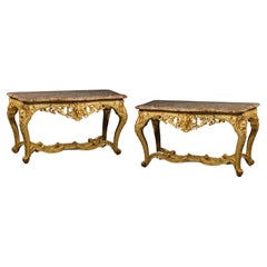 A Pair of Regence Style Carved Giltwood Console Tables