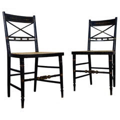 Pair of Regency 19th Century Ebonized and Caned Side Chairs