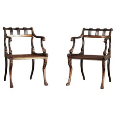Paire de fauteuils de style Régence ébonisés et dorés à la parcelle