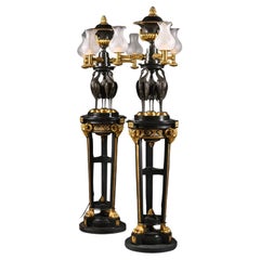 A Pair of Regency Style Gilt and Patinated Bronze Floor Lamps or 'Torchères'