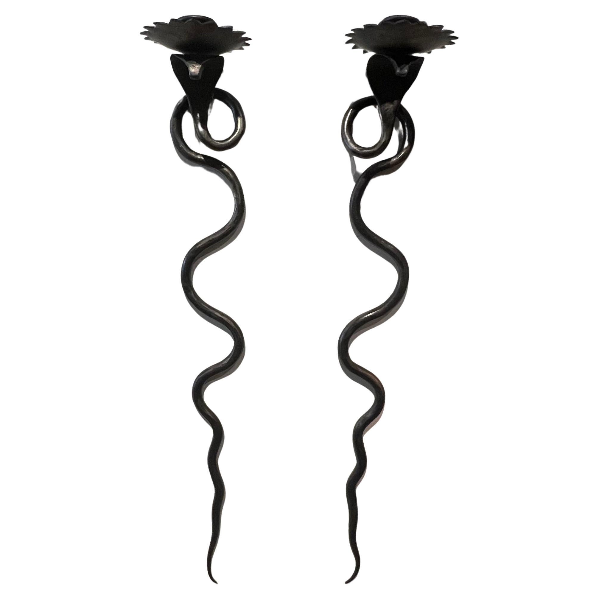 Pair Serpent Sconces in a gunmetal wrought iron finish For Sale