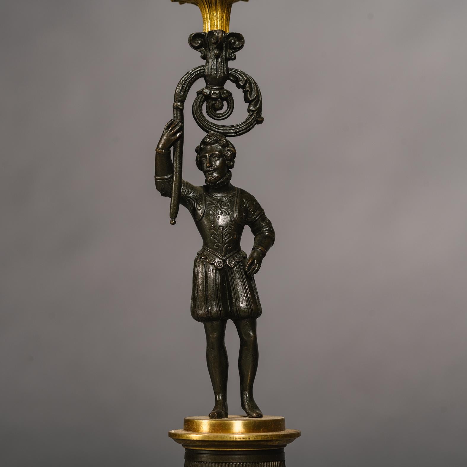 A Pair of Restoration Period Gilt and Patinated Bronze Four-Light Figural Candel In Good Condition For Sale In Brighton, West Sussex