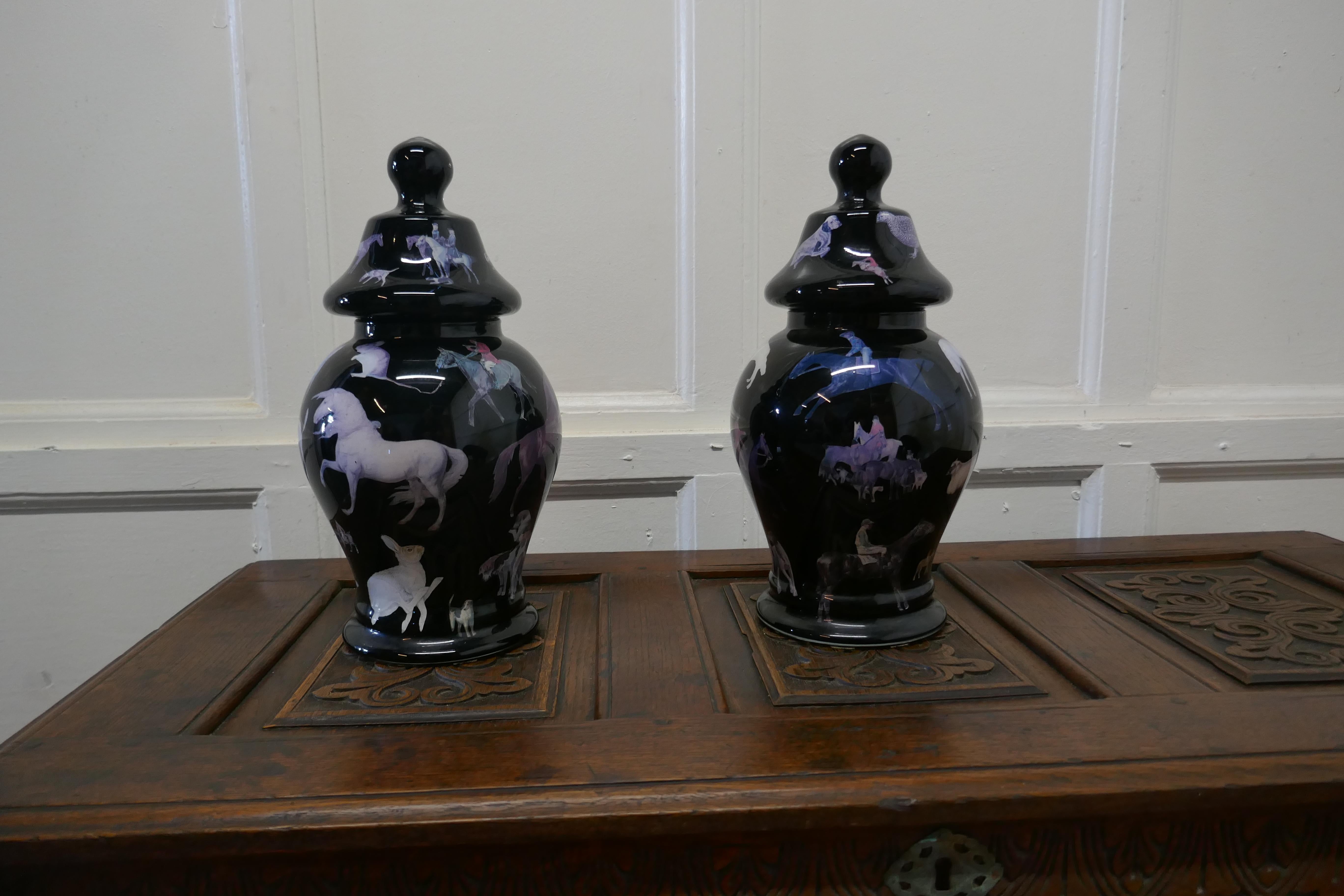 A pair of reverse painted Decoupage Baluster vases with covers

These black vases are decorated in a traditional way known as decalcomania, this involves positioning small pictures inside facing outward on the glass
These vases are in the themed