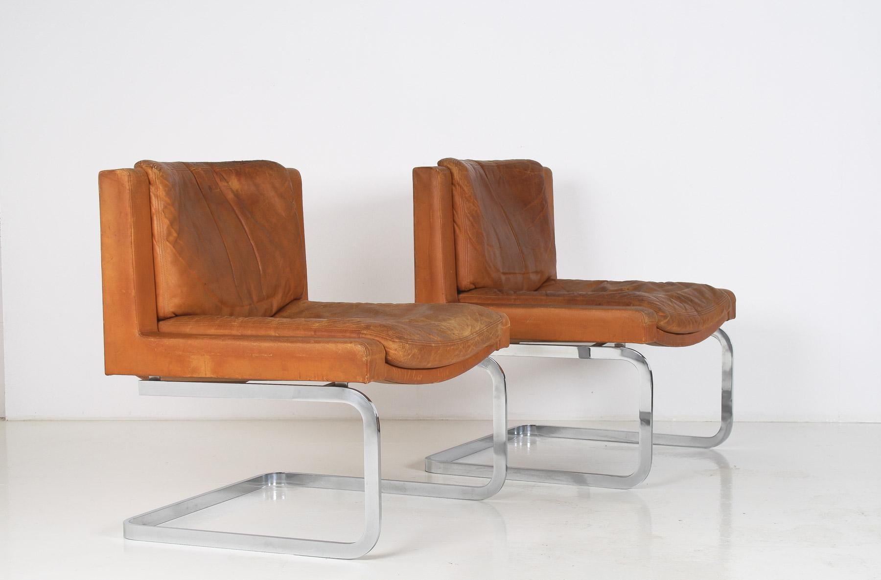 Mid-Century Modern A Pair of Robert Haussmann for De Sede DS-201 Mid Century Tan Leather Chairs For Sale