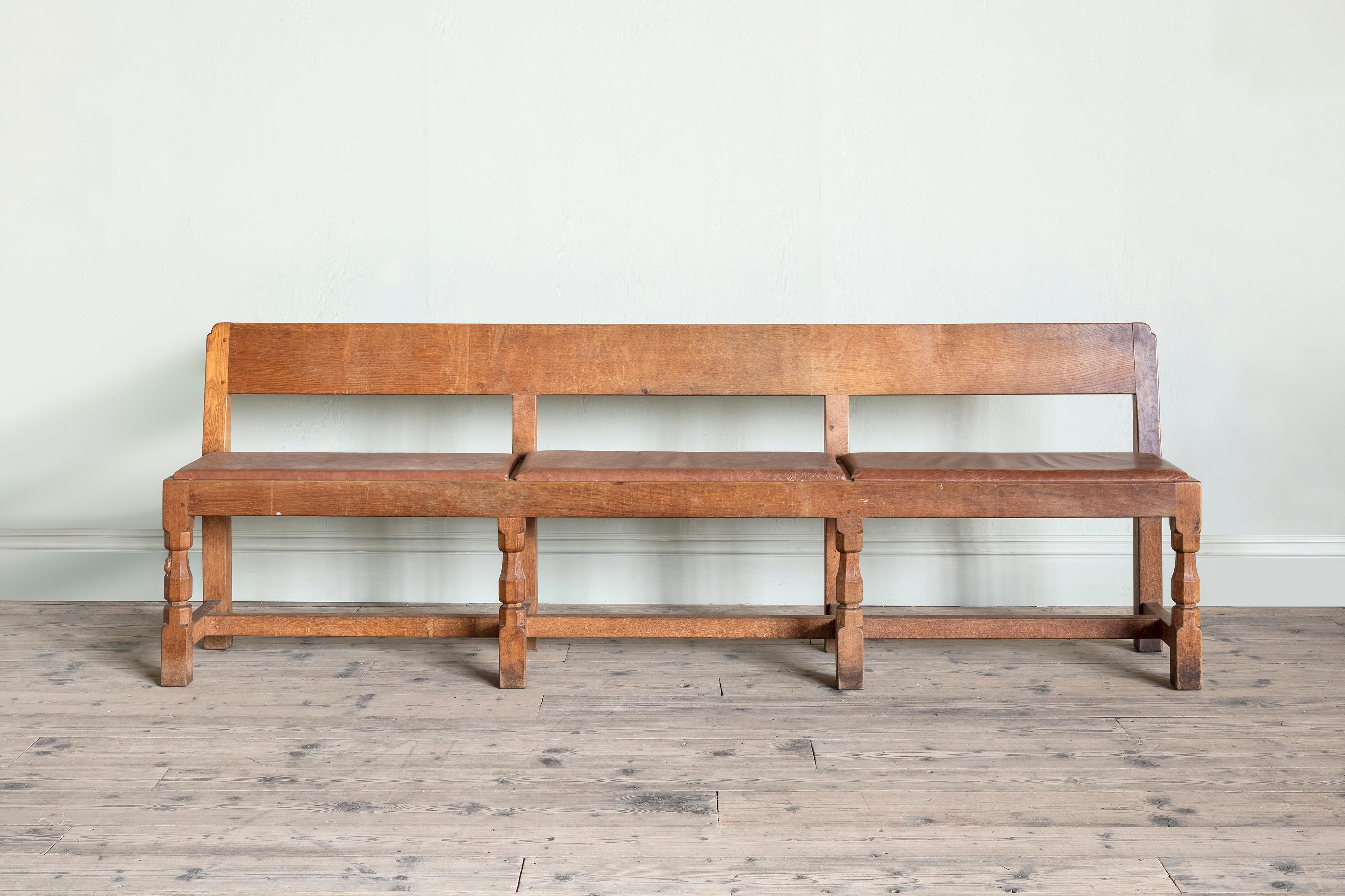 A pair of Robert ‘Mouseman’ Thompson (1876-1955) benches, Provenance: Ston Easton Park, Somerset.