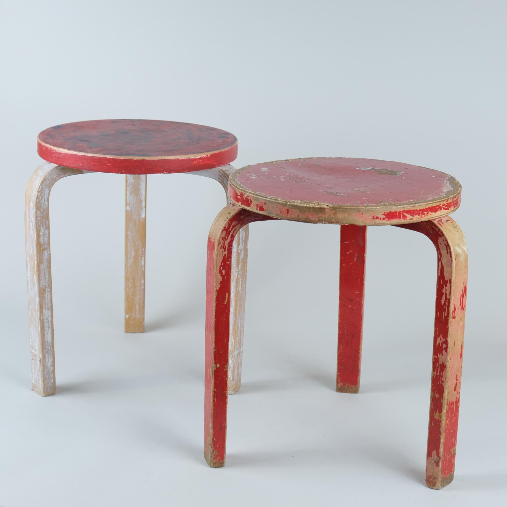 A pair of Artek stools in birch and multi layered colourful beautiful patina, designed by Alvar Aalto and retailed by Artek in the 1950s. The model 60 stool is perhaps the most well known Aalto design and has always been attractive to people. As