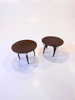 A pair of round Art Deco side tables in the style of Eugène Printz