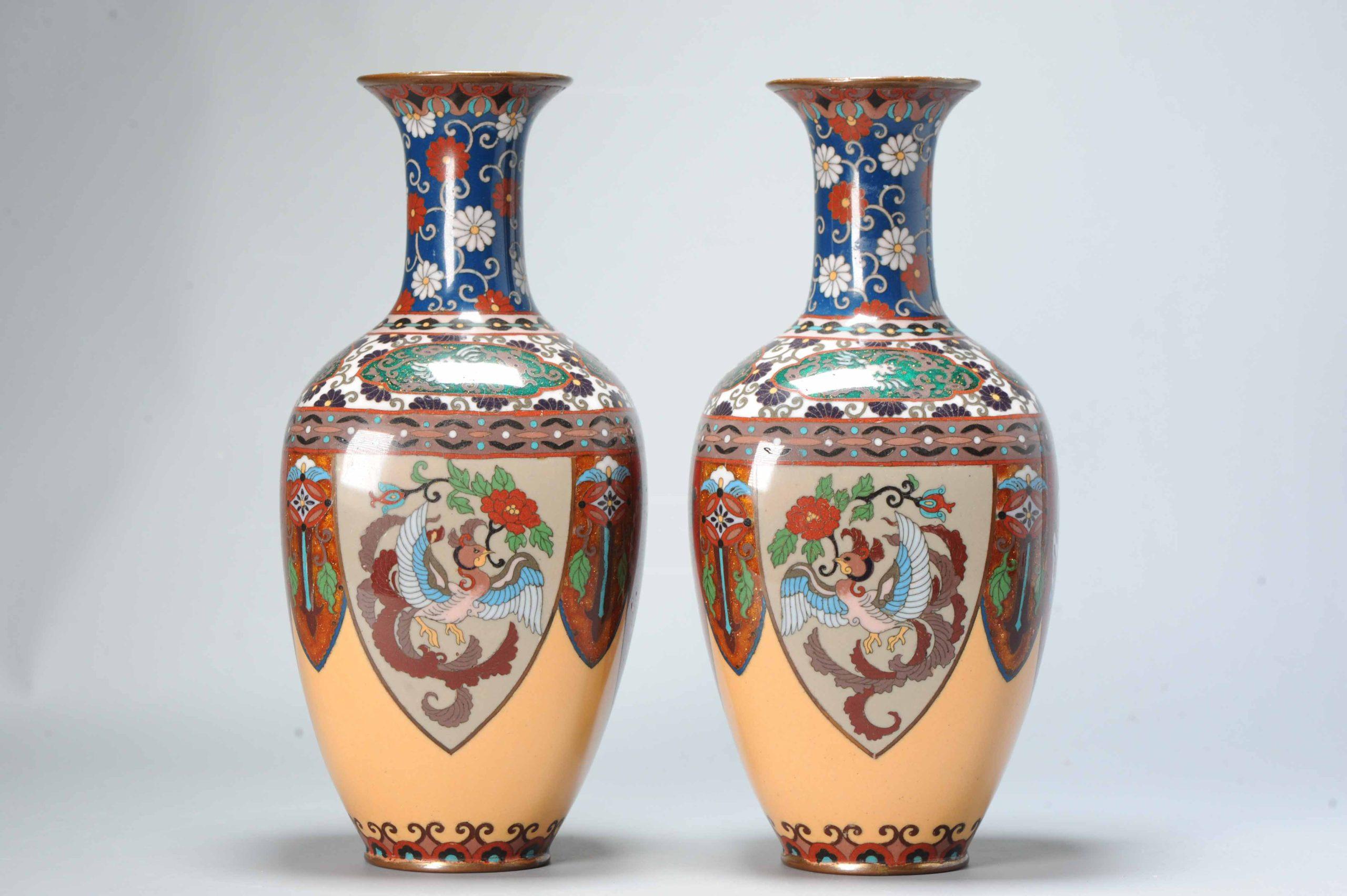 Top quality
Meiji era (1868-1912), 19th century
Each vase worked in gilt and wire of varying gauge with a mirrored design.

Condition
Vase one with some missing enamel/glaze spots and some scratches or bumspots. Vase 2 also with minimal
