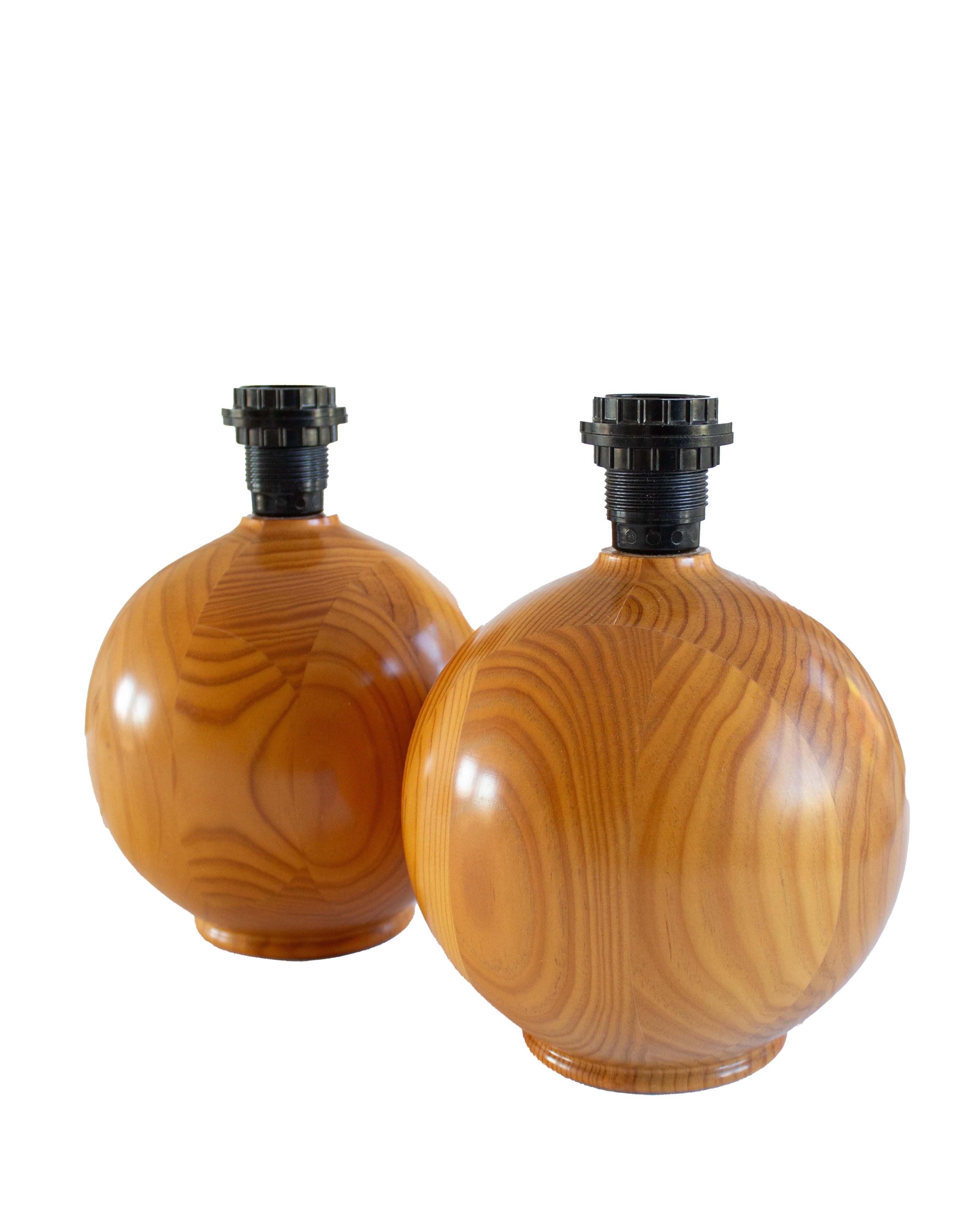 A Pair of Round Designer Table Lamps in Solid Pine from Sweden, 1970s
Sold without lampshades, dimensions for globe 21 cm. Height with socket is 28 cm. Standard E-26 medium base bulb. 
Other designers of the period include Axel Einar Hjorth and