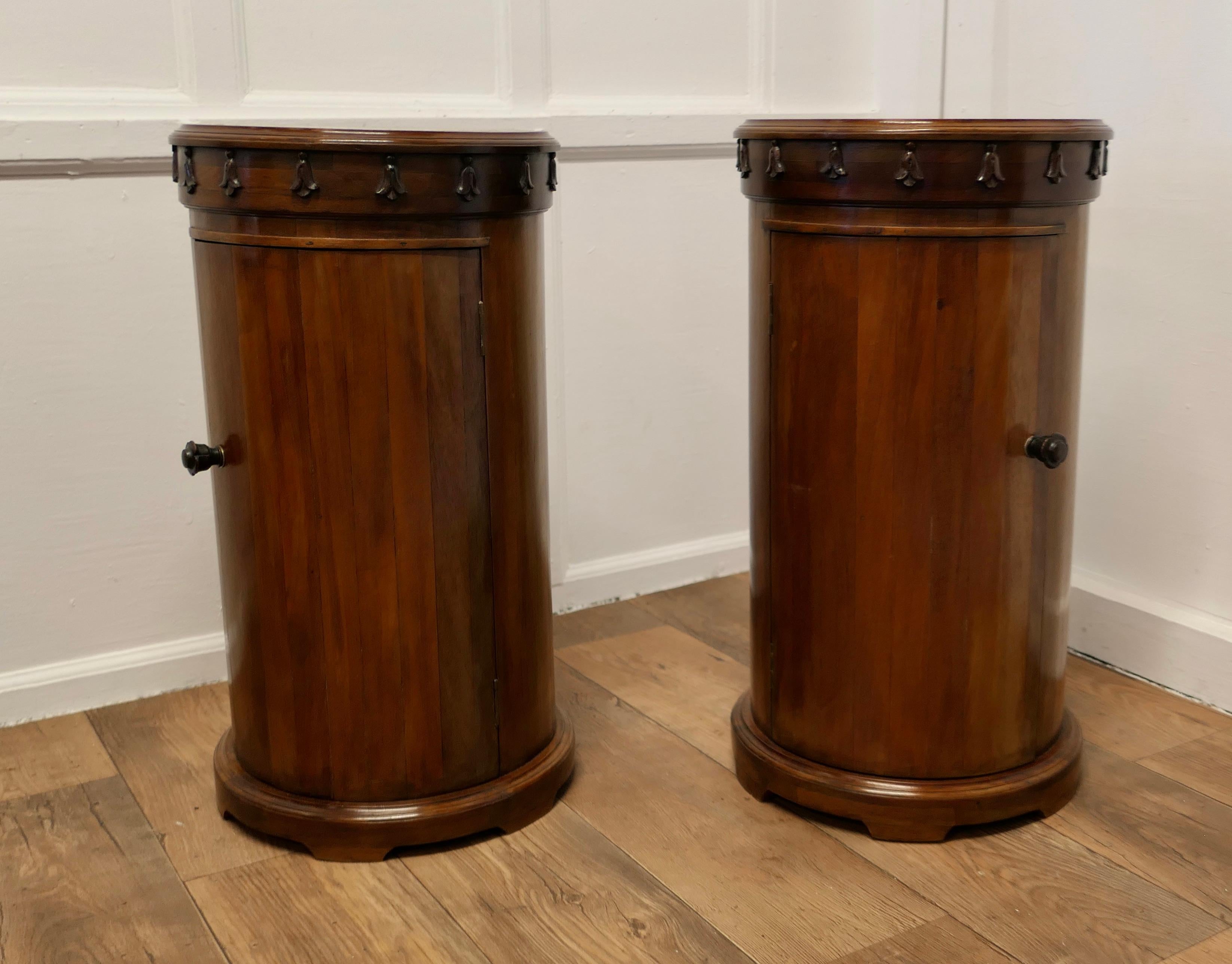 A Pair of Round Side Cabinets or Night Stands

This is a good quality pair of Circular Cabinets they each have a very decorative apron around the moulded top edge and are shelved inside
The Cabinets are very attractive, they are in good