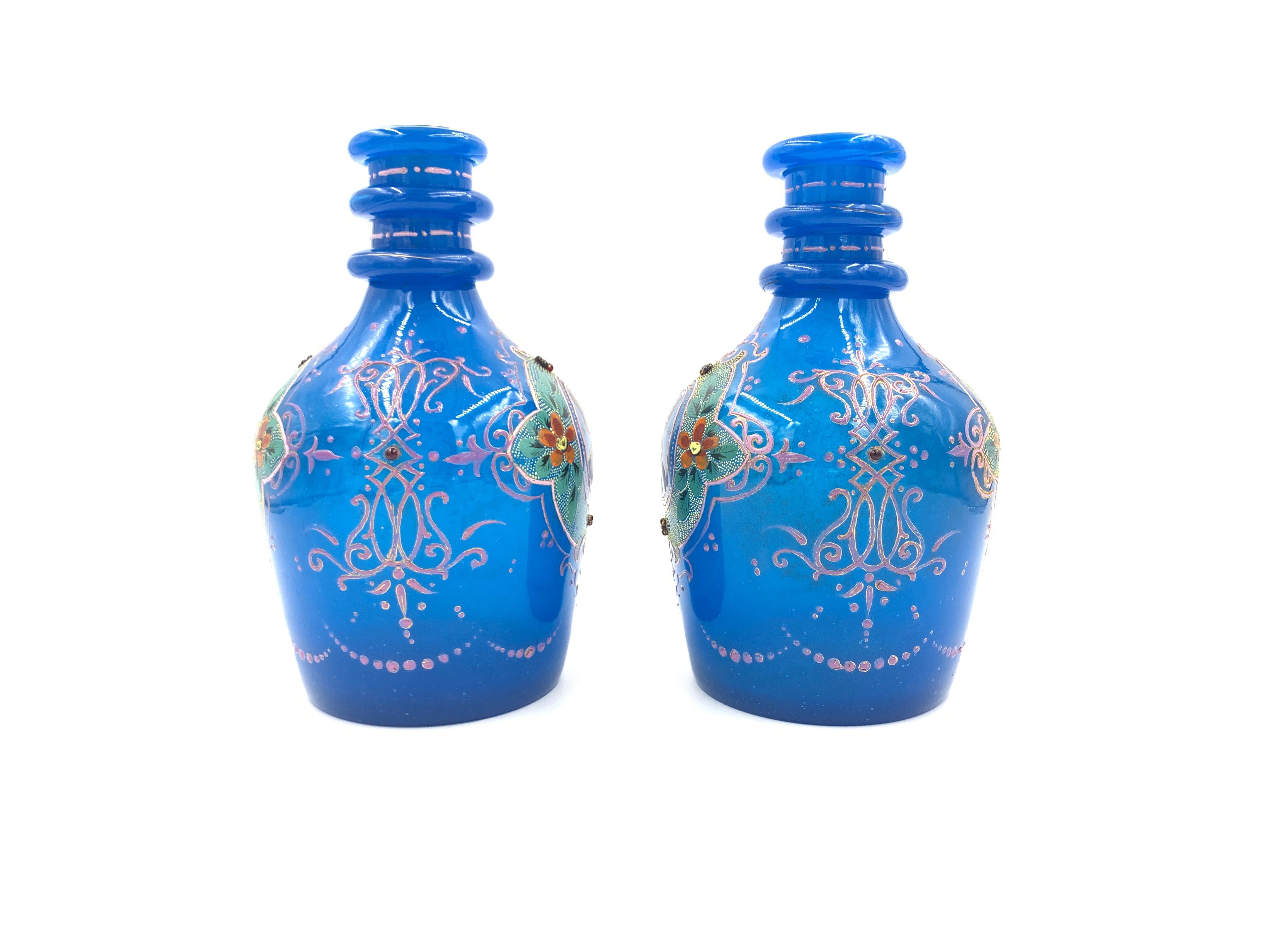 Pair of royal blue opaque enamelled bohemian glass hookah bases with portraits of Sultan Mozaffar AL-Din Shah dated 1315 Hijri which is equivalent to 1897 in the Gregorian calendar.
 