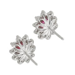 A pair of ruby and diamond cluster earrings