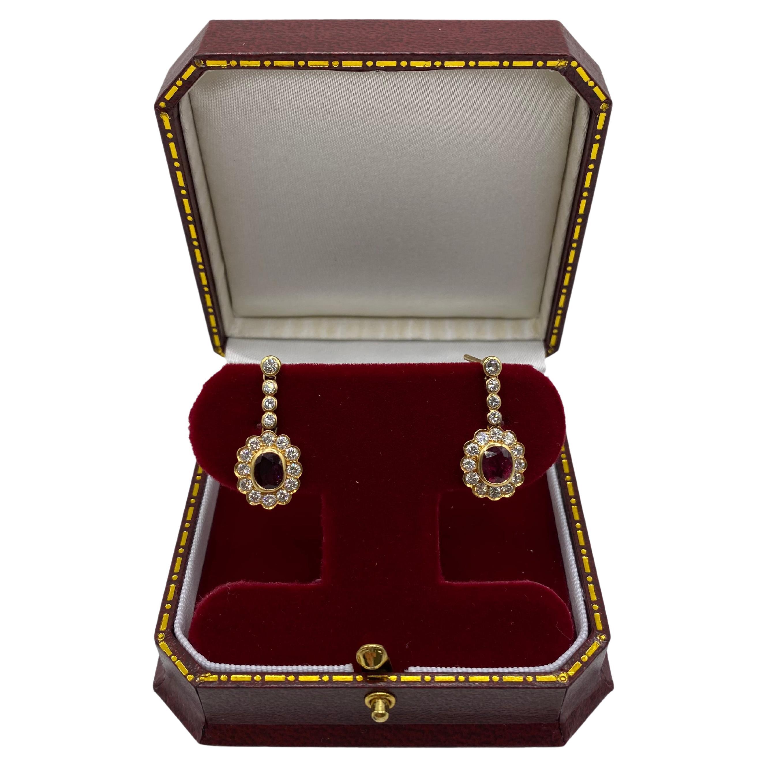 A pair of ruby and diamond pendant earrings For Sale