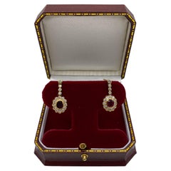 A pair of ruby and diamond pendant earrings