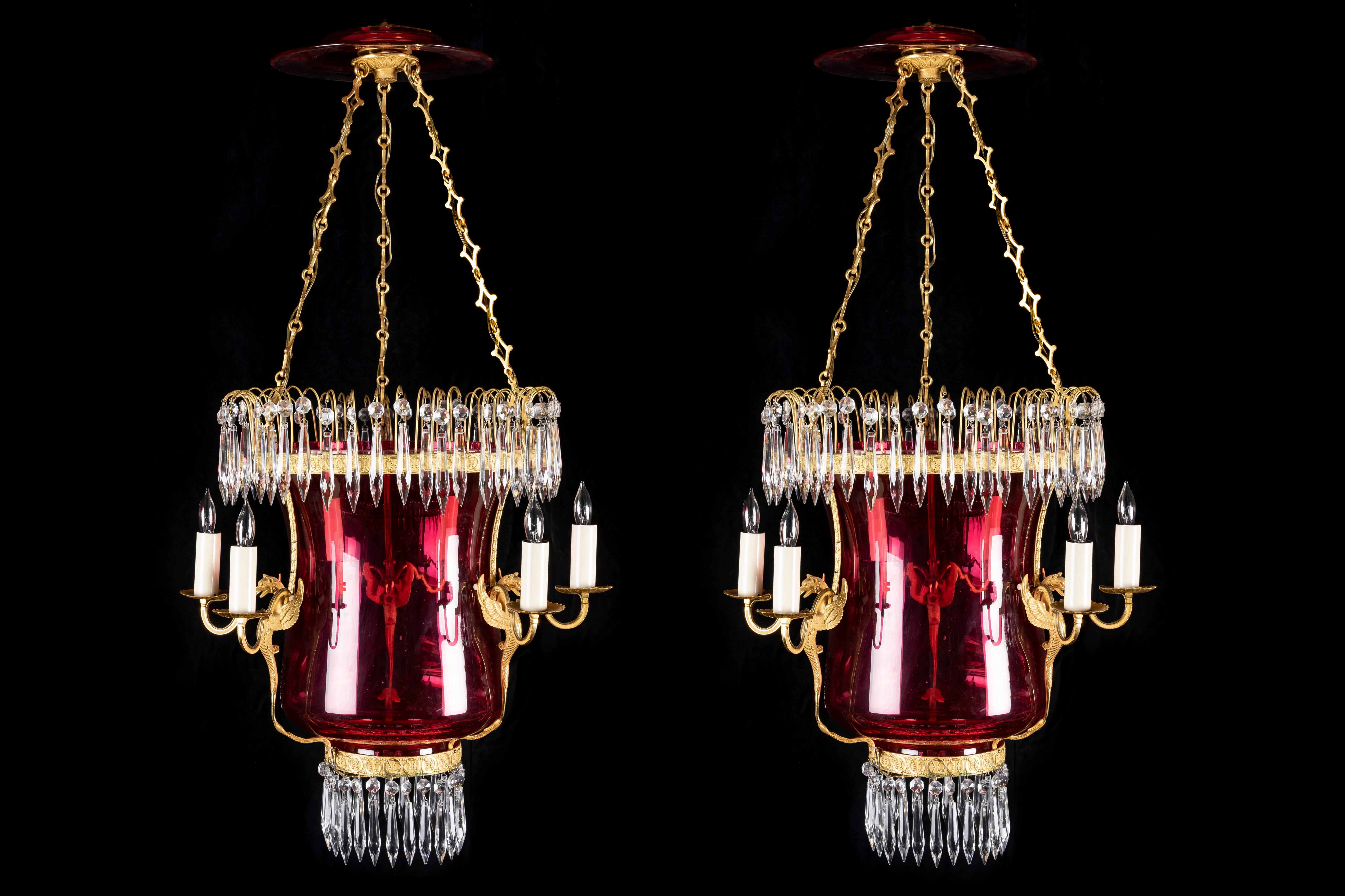 A Pair of Magnificent Large Antique Russian Neoclassical gilt bronze, cranberry glass and cut crystal multi light lantern chandeliers of exquisite craftsmanship. Each  unusual lantern is embellished with a fine Russian cranberry glass bell jar
