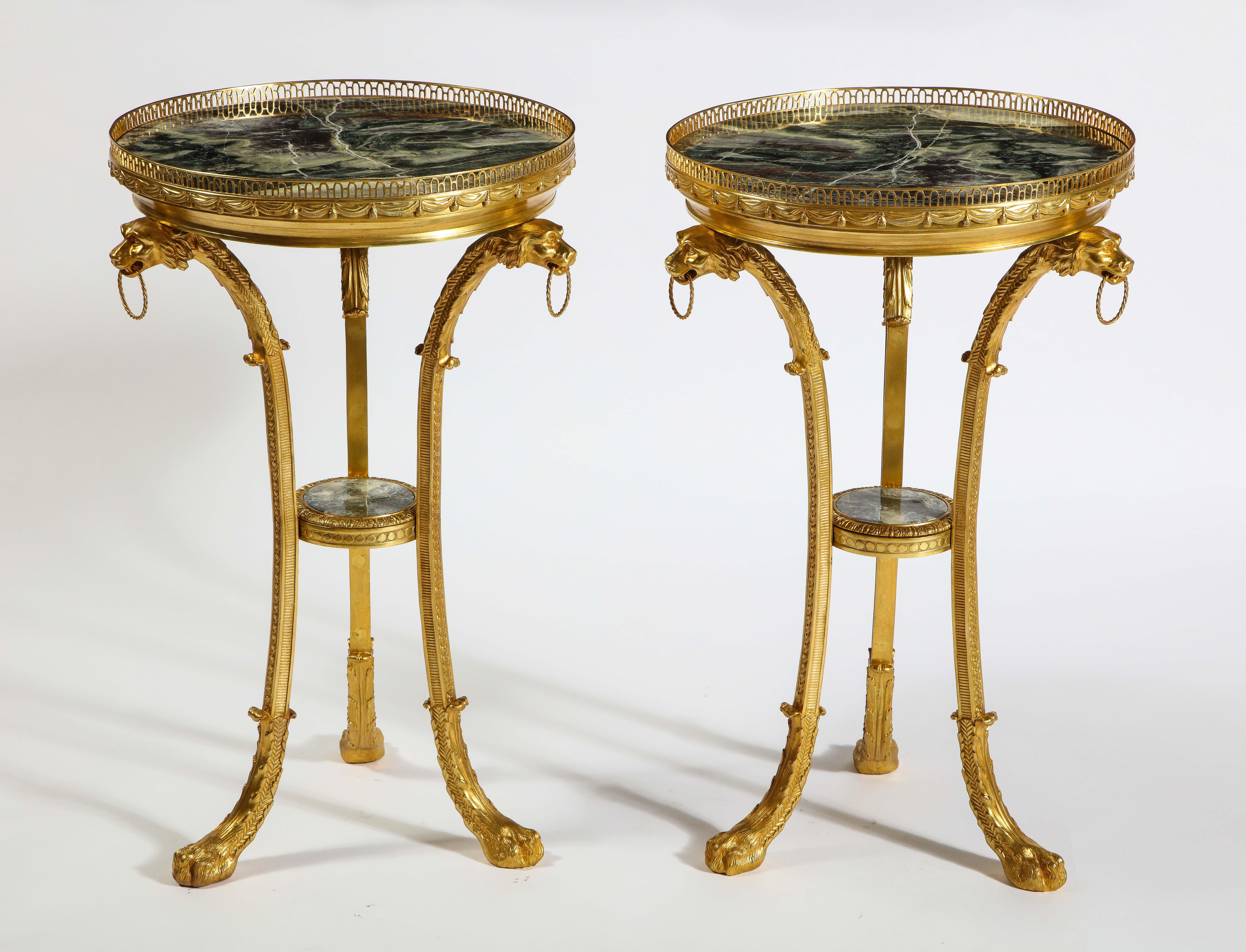 A magnificent pair of Russian neoclassical style gilt bronze and marble-top guéridons, based on a design by Andrei Voronikhin. This piece is beautifully cast and hand-chiseled, producing an exceptional, well-crafted pair of guéridons. Each table is
