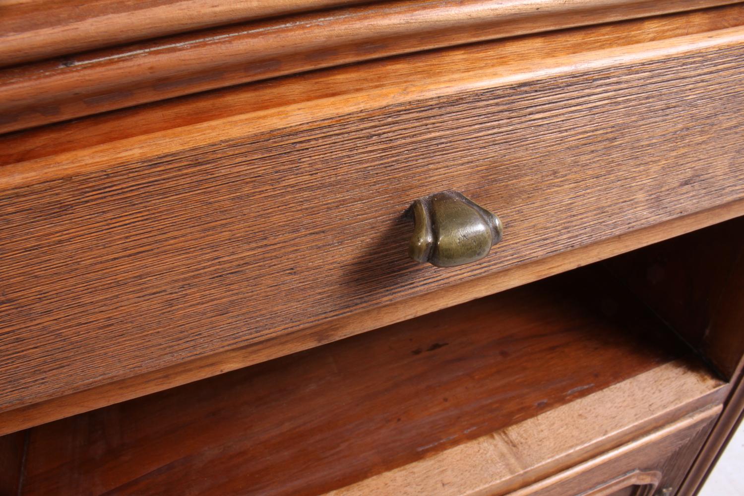 A pair of rustic Italian bedside cabinets, circa 1920
A pair of bedside cabinets in solid walnut with raised grain centers and brass handles, single drawer above a shelf and a single door, in original condition

Age: 1920

Style: