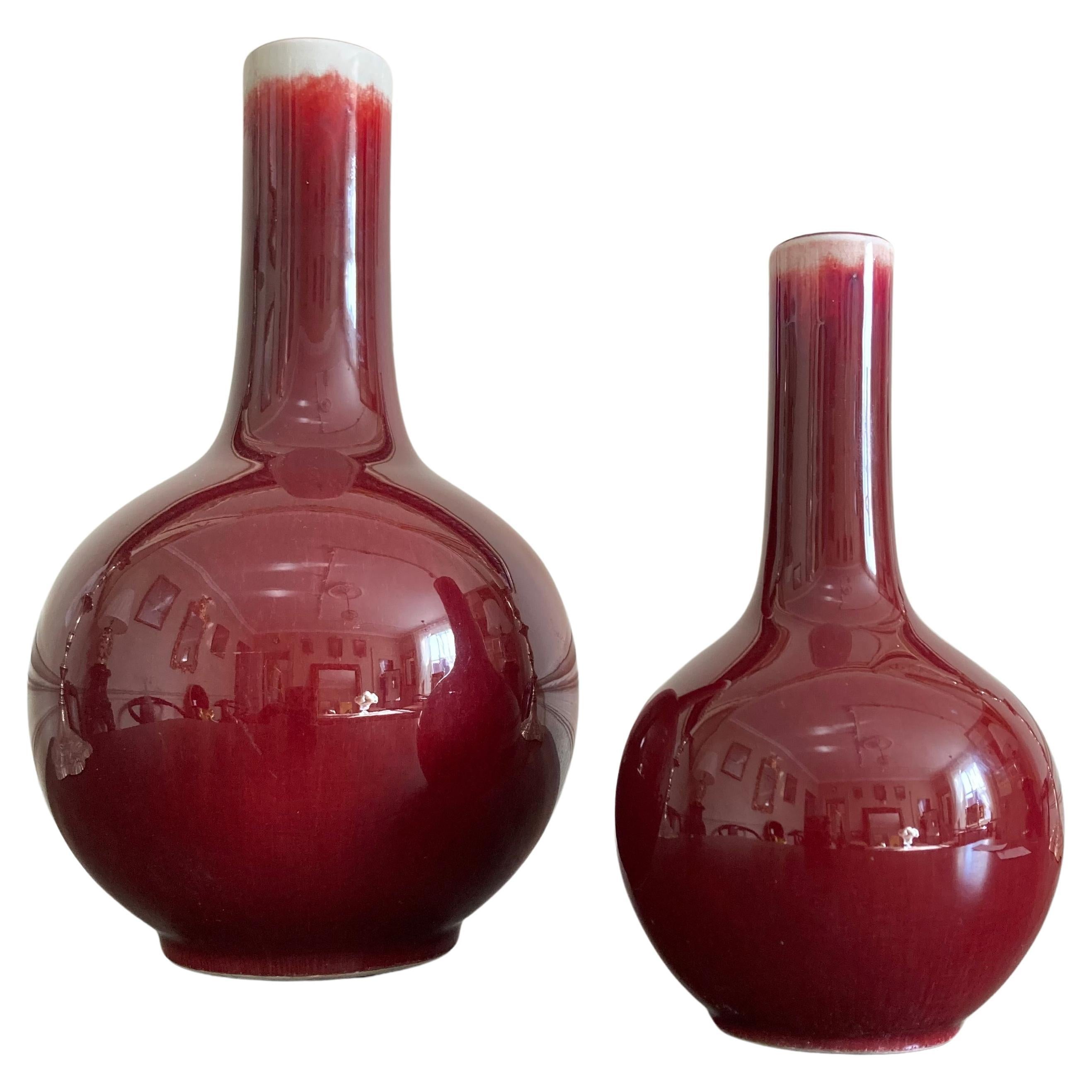 A pair of Sang De Bouef Red Flambe flask vases For Sale