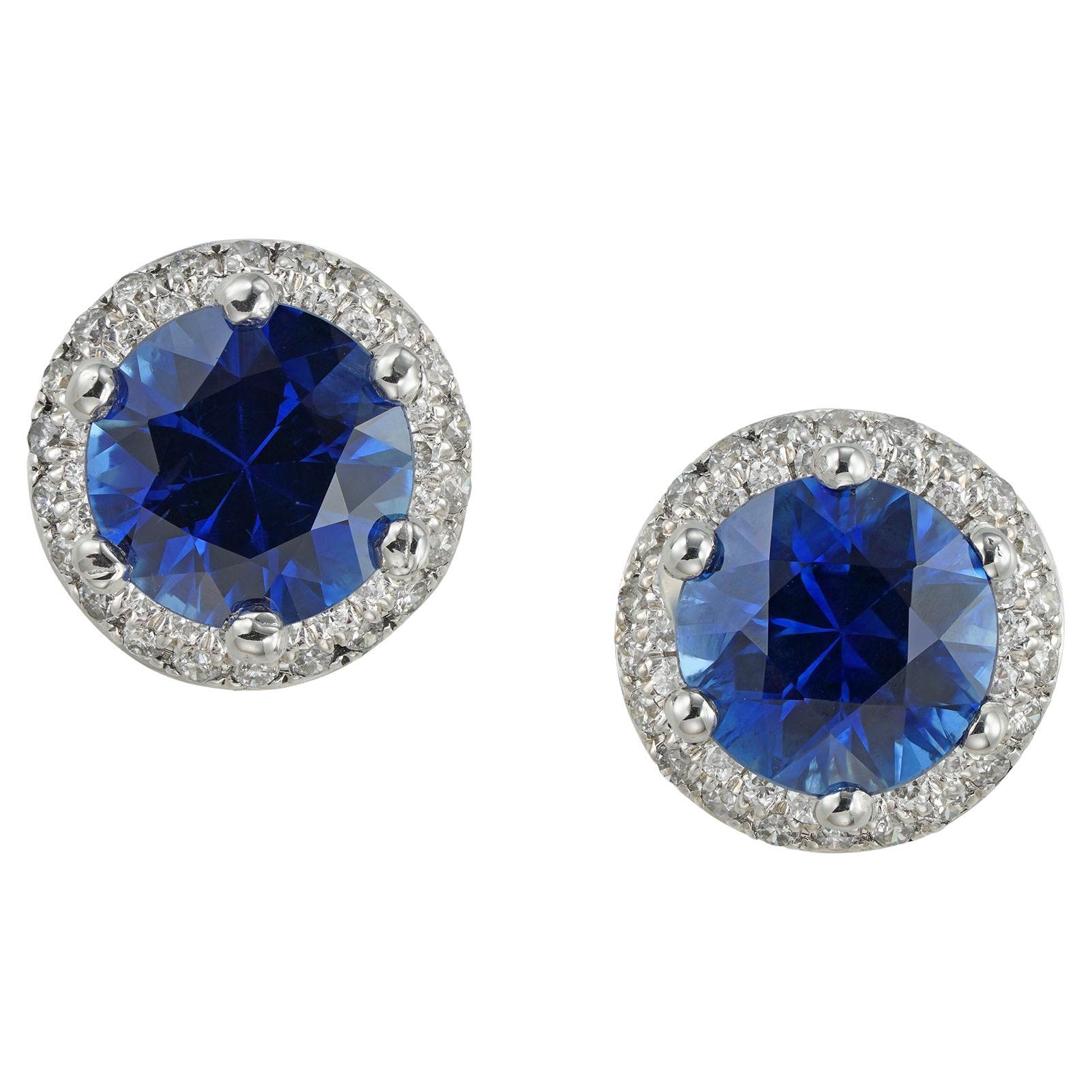 A pair of sapphire and diamond cluster earrings