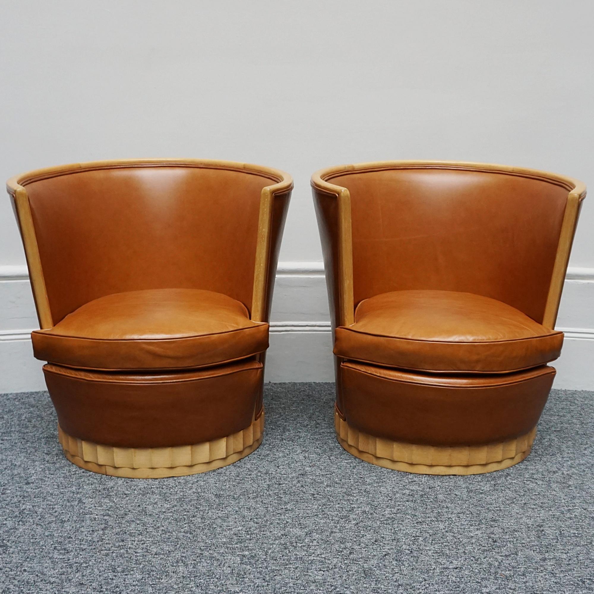 A pair of Art Deco tub chairs. Satin birch fluted base and frame with brown leather re-upholstery. 

Dimensions: H 79cm W 75cm D 75cm Seat H 39cm W 49cm D 69cm

Origin: French

All of our furniture is extensively polished and restored where