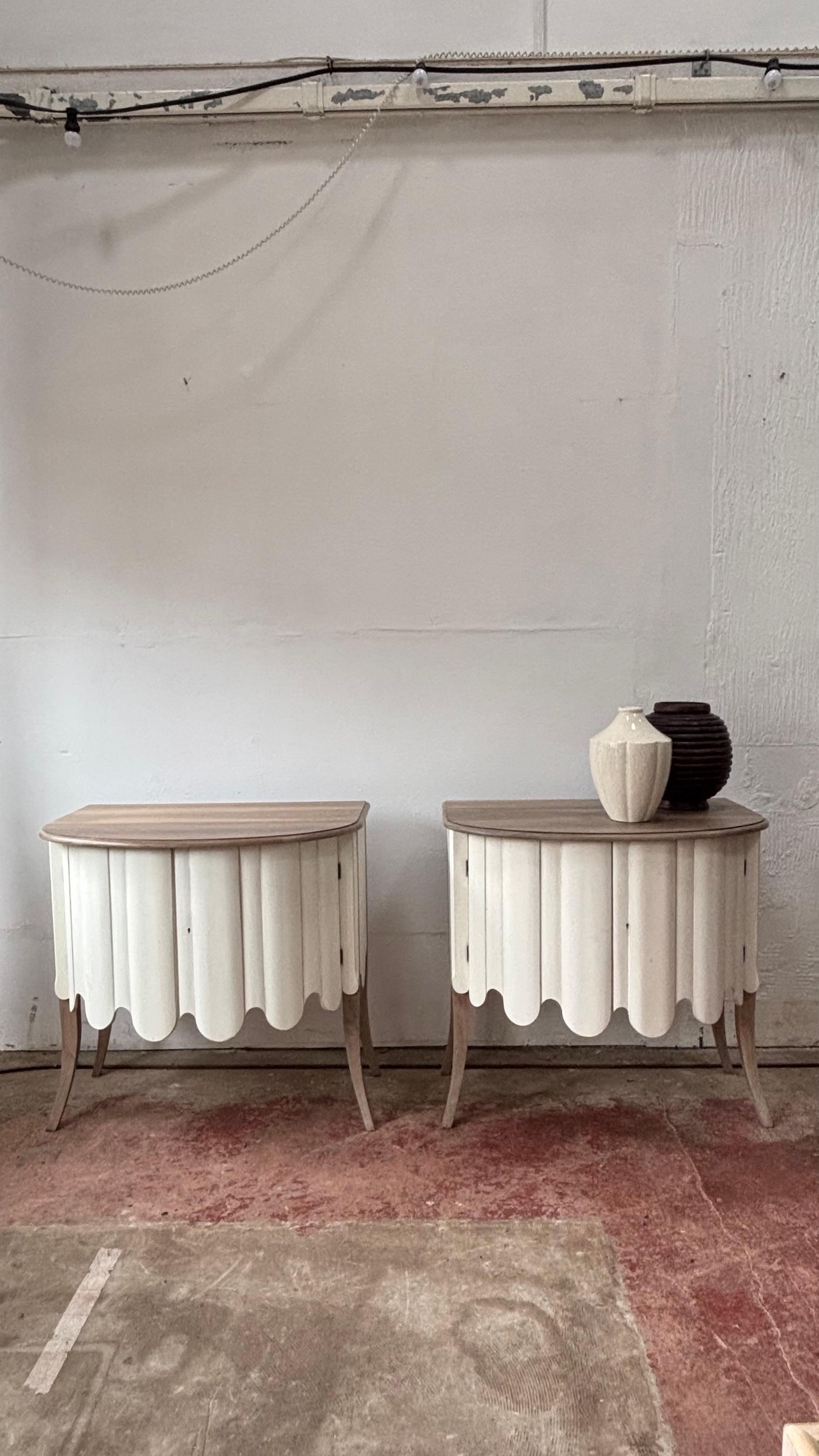 This pair of beautiful commode chests have a wonderful shaped, scalloped front that has a gently bow.  The line of the chests give an elegant and glamorous touch! A 