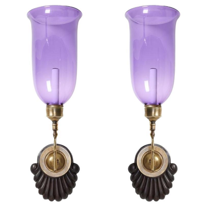 A Pair of Scallop Sconces with Flared Violet Hurricane Shades