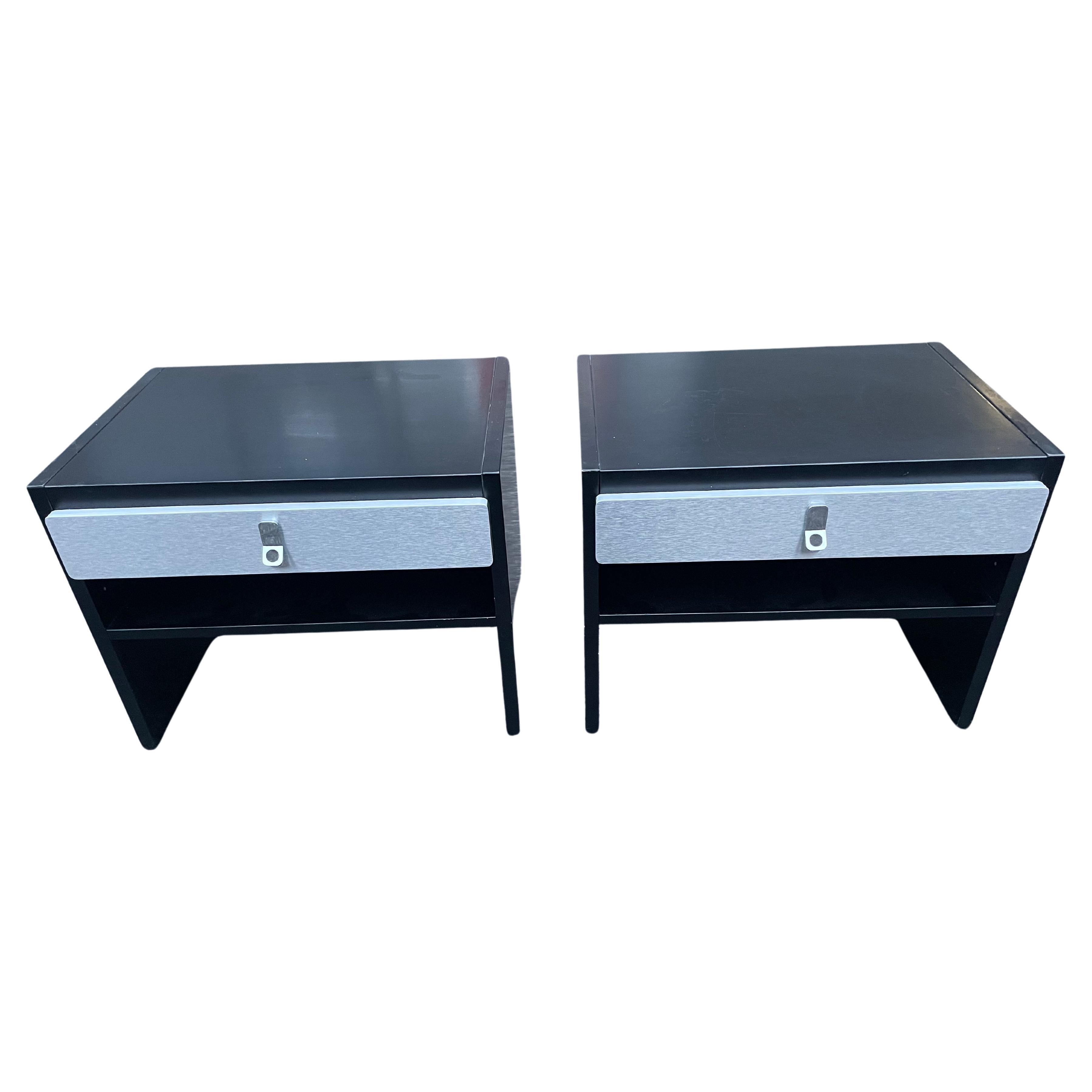 AvantiNight stands by Antonio Gioia, crafted in sleek black lacquered wood and chrome. These tables epitomize Scandinavian design, blending refined luxury with simple elegance.

The Avanti Night stands are a perfect mix of form and function. Their