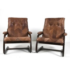 A Pair of Scandinavian Bentwood Lounge Chairs With Patchwork Leather