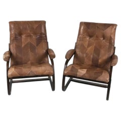 A Pair of Scandinavian Bentwood Lounge Chairs With Patchwork Leather