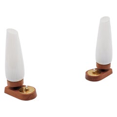 A Pair of scandinavian table lamps made in teak and glass, 1960s