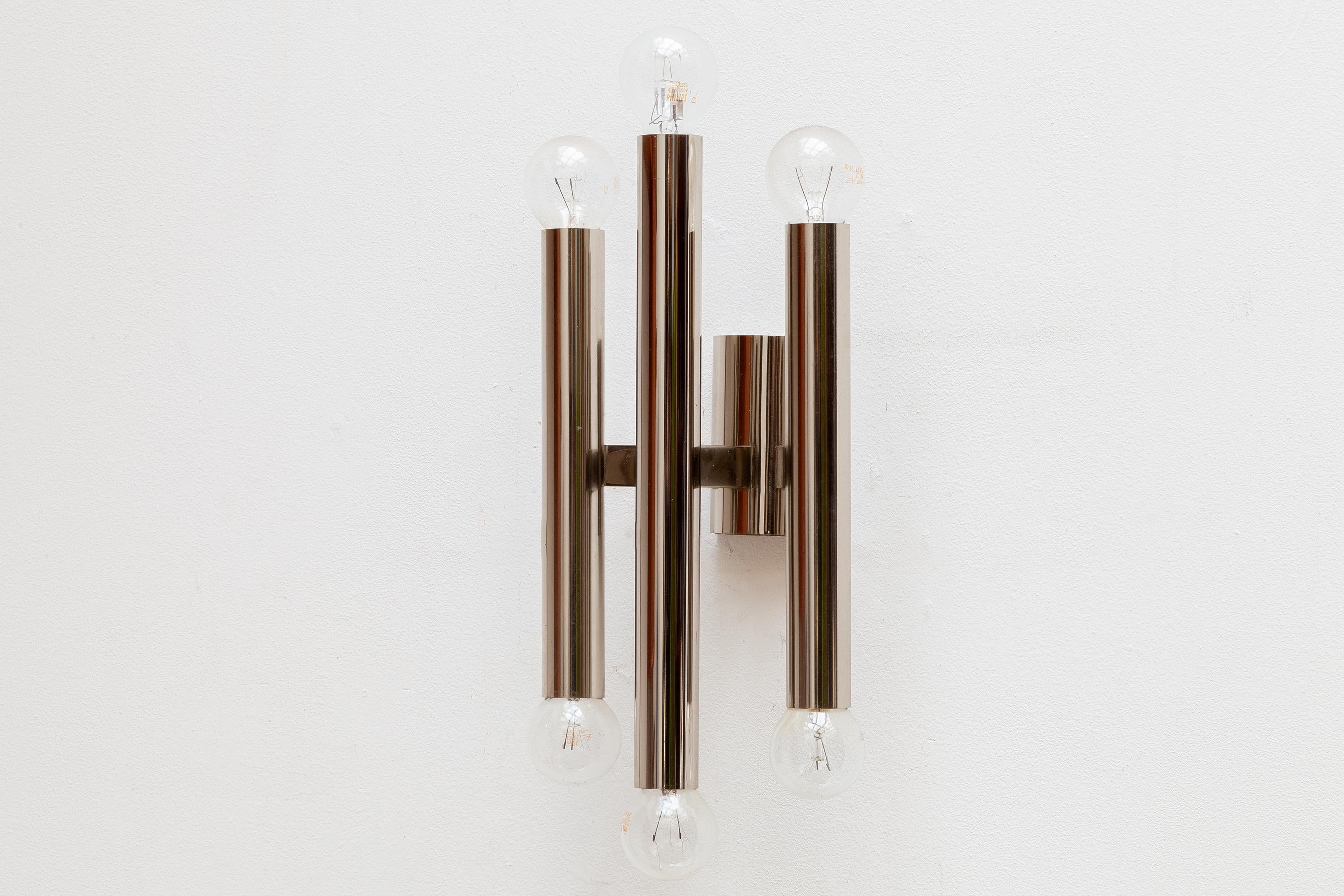 A beautiful pair of vintage 1970s chrome wall sconces, designed by Sciolari. Lit by 6 bulbs.Dimensions of one sconce 16W x 30H x 12D cm.Original perfect condition.