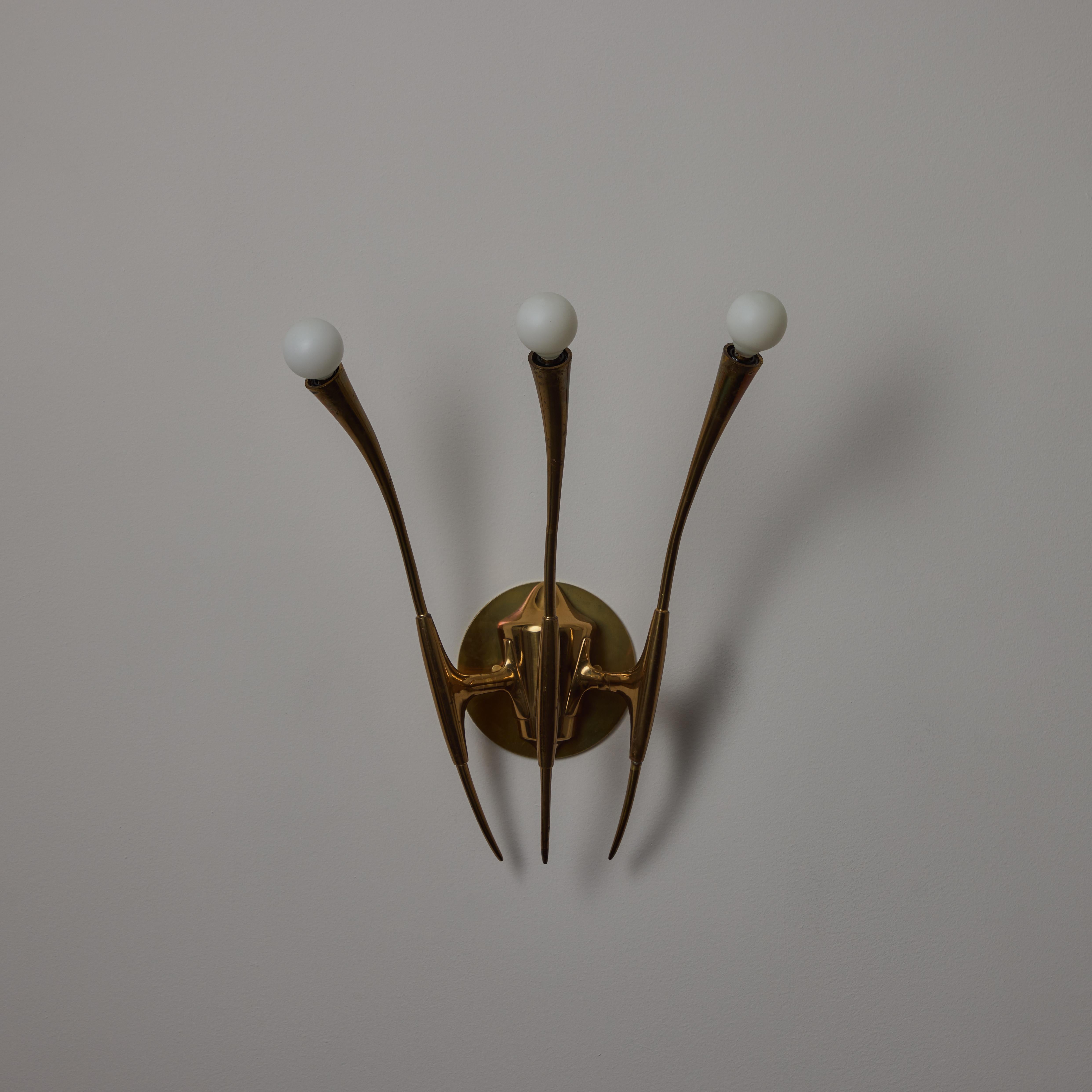 Patinated A Pair of Sconces by Oscar Torlasco For Sale