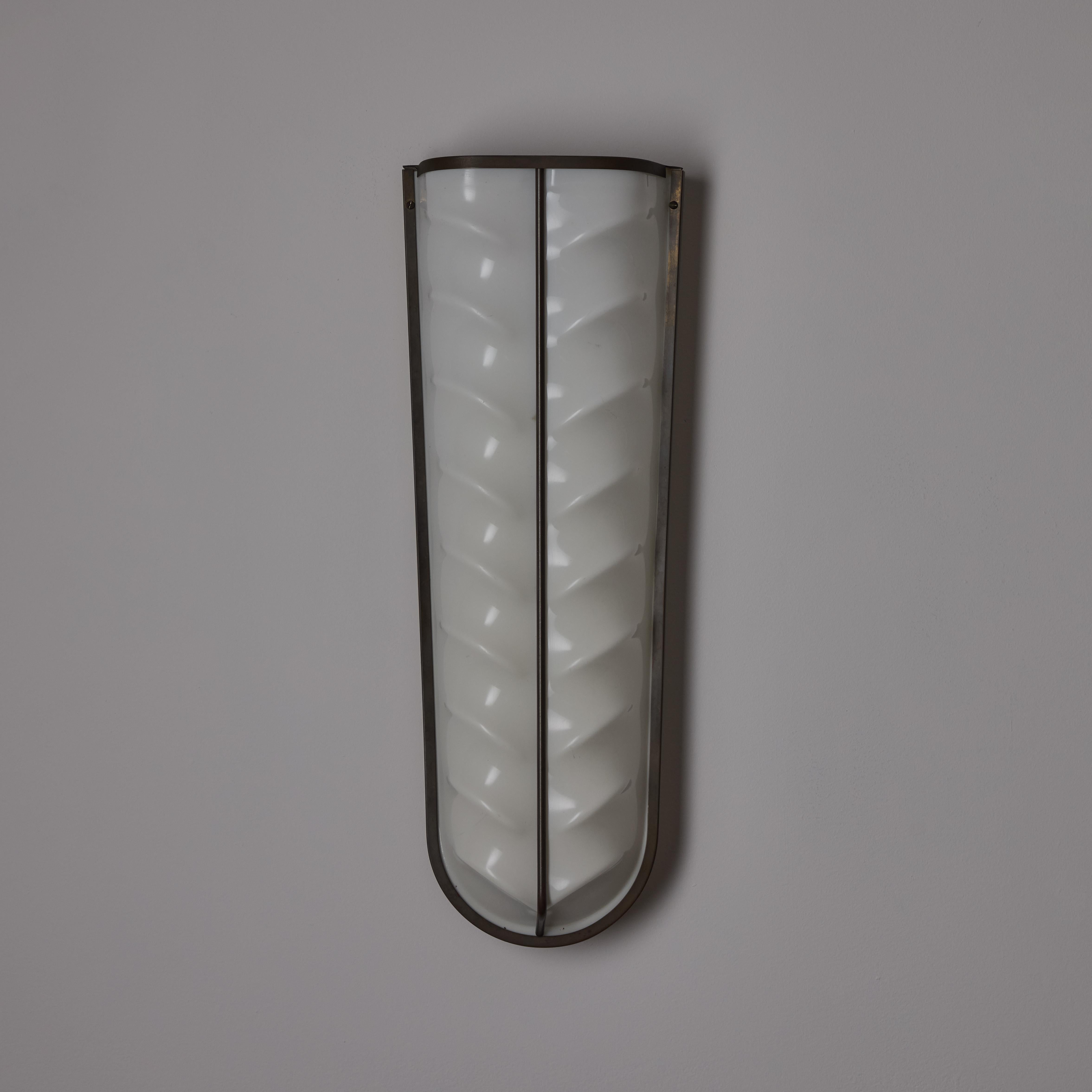 A Pair of Sconces by Stilux 3