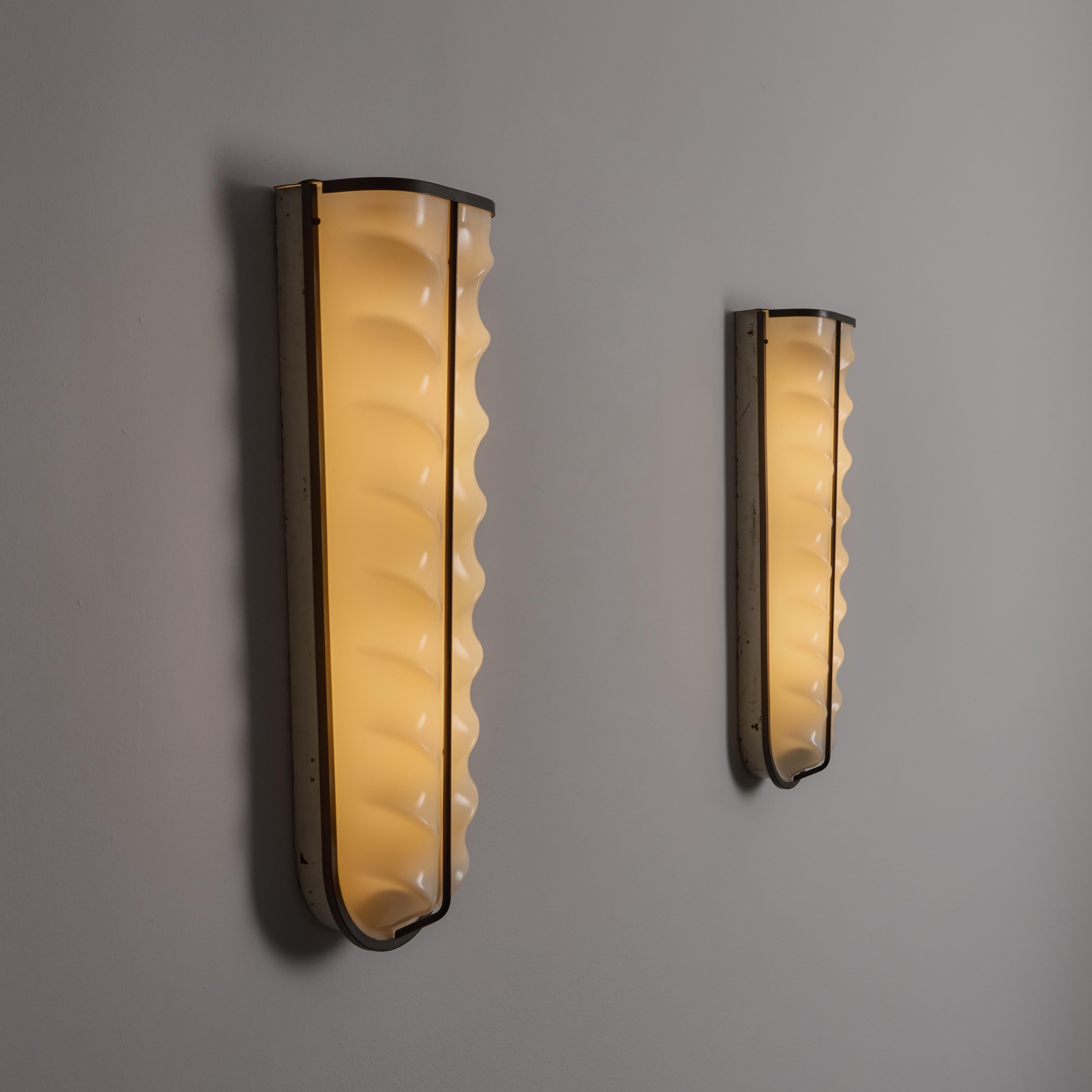 A Pair of Sconces by Stilux 4