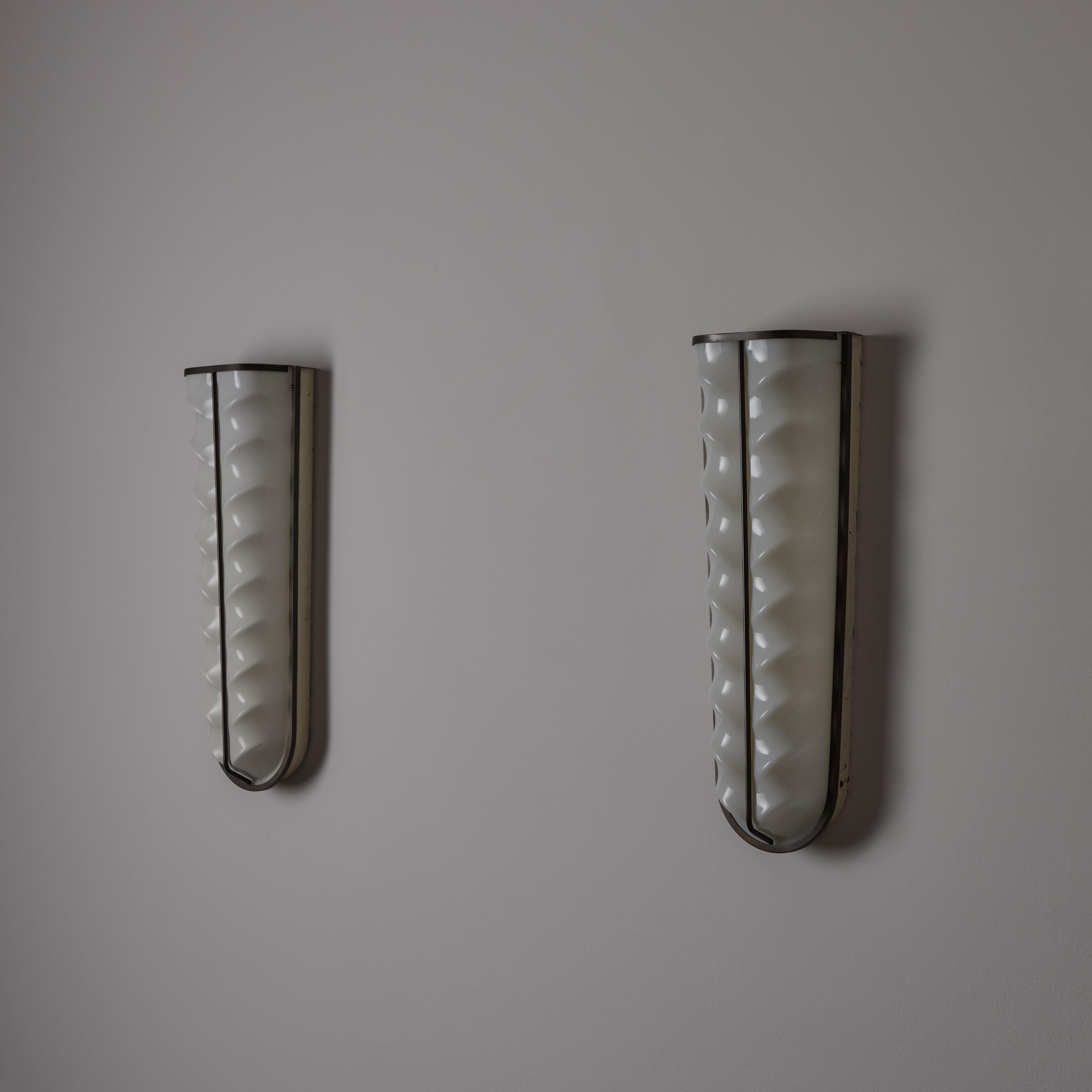 Patinated A Pair of Sconces by Stilux